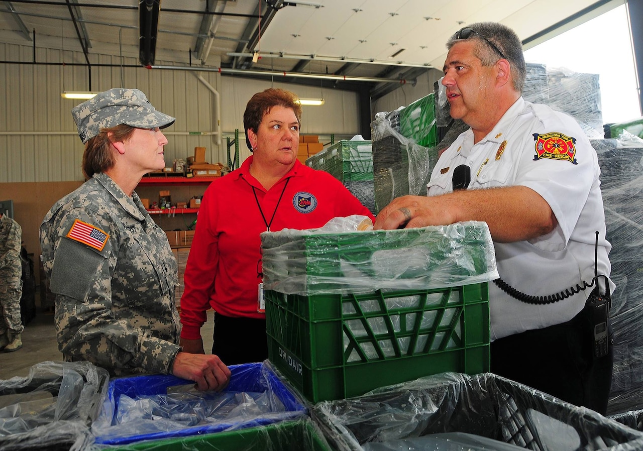 Army Maj. Gen. Deborah A. Ashenhurst, Ohio’s adjutant general, visits with emergency personnel Aug. 3, 2014, in Toledo, Ohio. The city and its surrounding area are experiencing a clean-water emergency. Pictured in center is Sima Merick, assistant director of the Ohio Emergency Management Agency. U.S. Army photo by Staff Sgt. Nicholas Pavlik