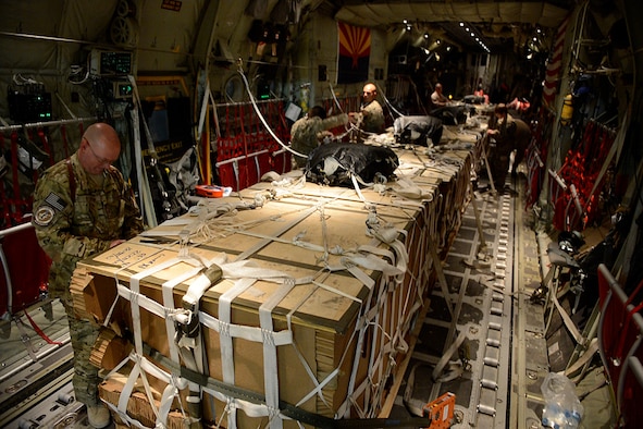 Master Sgt. Bradley Nulf, 774th Expeditionary Airlift Squadron evaluator loadmaster secures cargo for an airdrop at Bagram Airfield, Afghanistan Aug. 1, 2014.  The squadron is using the new Wireless Gate Releases System for airdrops.  The WGRS saves the Air Force in material, fuel costs and man hours. Nulf is deployed from Dyess Air Force Base, Texas and a native of Columbia City, Ind. (U.S. Air Force photo by Staff Sgt. Evelyn Chavez)