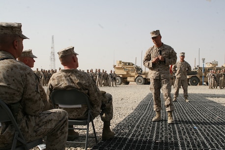 Lt. Col. Joon H. Um, right, commanding officer, Combat Logistics Battalion 1, addresses guests during a transfer of authority ceremony held aboard Camp Leatherneck, Helmand province, Afghanistan, Aug. 1, 2014. Combat Logistics Battalion 1 replaced CLB-7 as the last unit to aid Regional Command (Southwest) with tactical-level logistical support and will close out another chapter in Marine Corps history as the last unit to serve as the logistics combat element for RC(SW).