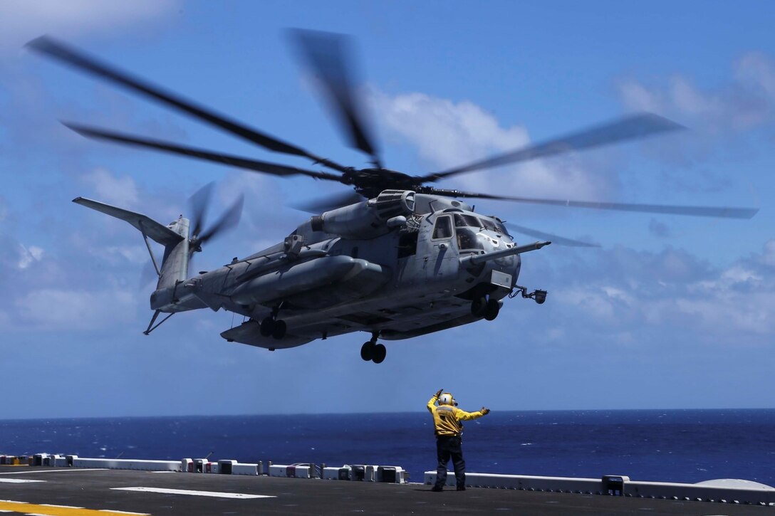 A CH-53E Super Stallion with Marine Medium Tiltrotor Squadron 163 (Reinforced), 11th Marine Expeditionary Unit, takes off from the flight deck of the USS Makin Island, Aug. 1.  The 11th MEU and Makin Island Amphibious Ready Group are deployed as a sea-based, expeditionary crisis response force capable of conducting amphibious missions across the full range of military operations. (U.S. Marine Corps photo by Lance Cpl. Laura Y. Raga/Released)