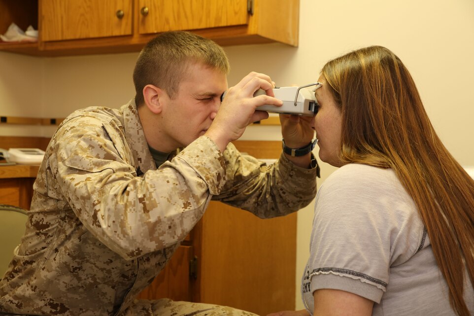 Petty Officer 3rd Class Neal Patrick, a hospital corpsman with 4th Medical Battalion and native of Dayton, Ohio, checks the distance between a patient’s pupils using a pupilometer during Innovative Readiness Training Arkansas Care, July 30, 2014. IRT Arkansas Care served the residents of a seven county area known as the Arkansas Delta region. The joint-service Reserve units provided a variety of general medical, optometry and dental services while simultaneously gaining the training they need for their military occupational specialty.