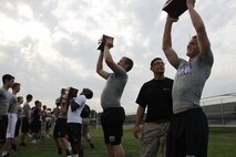 Blue Valley Northwest High School Huskies football players perform ammo-can lifts with 30-pound ammunition cans as Marines from Marine Corps Recruiting Station Kansas City and Recruiting Sub-Station Olathe keep score during the Huskies' Combat Fitness Test as the Huskies' practice field. Aug. 5, 2014. 