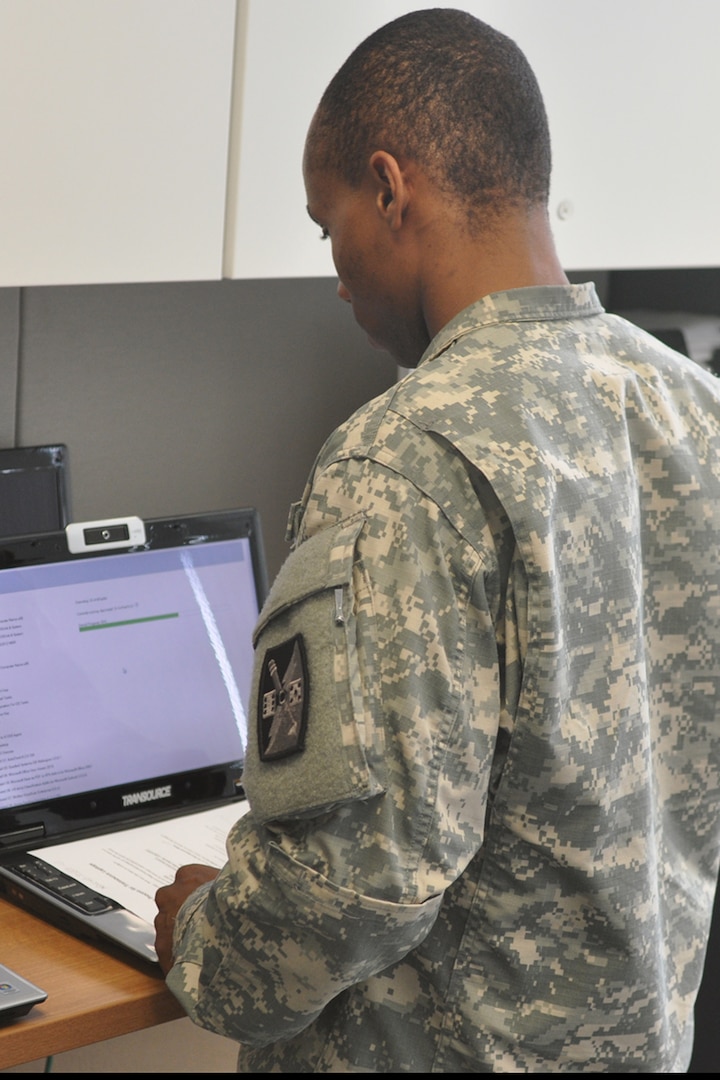 A North Carolina National Guard Soldier updates computers at the NCNG's Joint Force Headquarters in Raleigh, Aug. 4, 2014. The NCNG is "Always Ready" against any threat including cyber attacks.  Our Soldiers, Airmen and staff stand poised, ready and capable to support the National Guard Bureau`s intent to stand up multiple Cyber Protection Teams (CPT) in support of U.S. Cyber Command.
