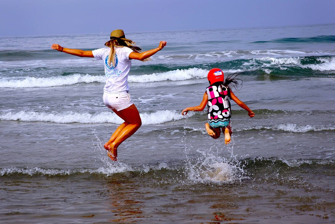 CAMP PENDLETON, Calif. -- Laura Delpena, an event volunteer, and Kaylee, 7, enjoy time in the ocean during the Exceptional Family Member Program beach event at Del Mar Beach, Aug. 2-3. 

The Best Day Foundation Orange County Chapter hosted the event for special needs children that are enrolled in the EFMP. The event provided activities such as surfing, body boarding, kayaking and more. 

“For families like us, we don’t have a lot of opportunities for our kids to experience what the normal family might,” said Jolanda Graham, parent and volunteer EFMP family representative 

Involved parents such as Graham also appreciate experienced volunteers who make these activities safe and possible.

