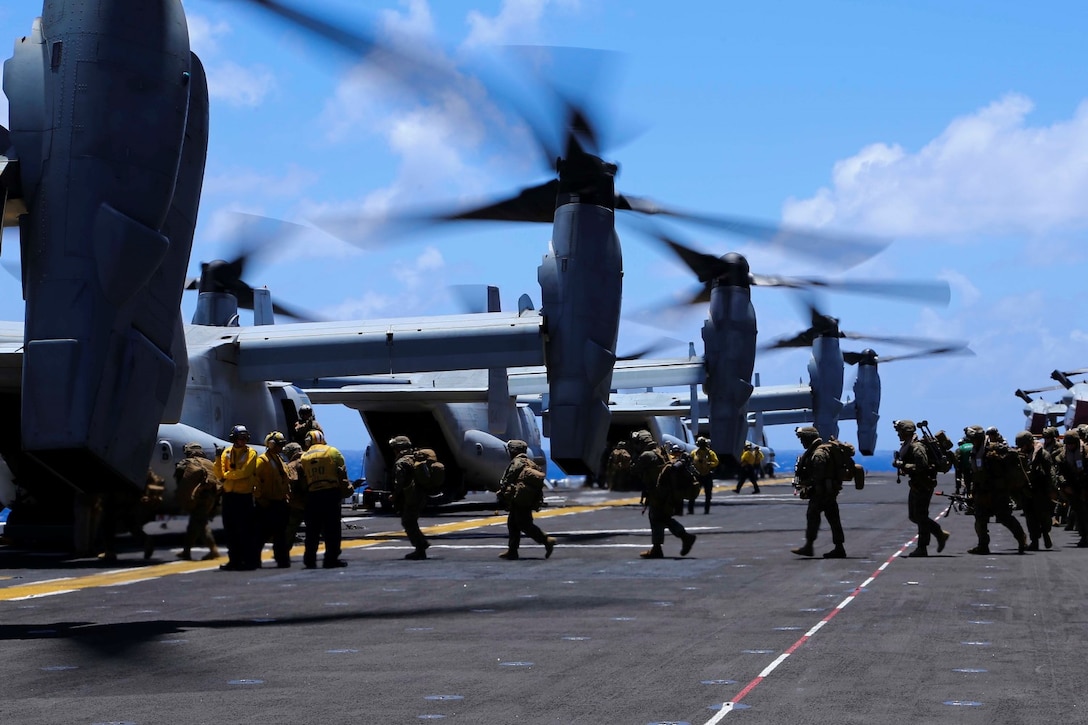 Marines with Golf Company, Battalion Landing Team 2nd Battalion, 1st Marines, 11th Marine Expeditionary Unit, load onto MV-22B Ospreys with Marine Medium Tiltrotor Squadron 163 (Reinforced), 11th MEU, for training Marine Corps Training Area Bellows, Hawaii Aug 1..  The 11th MEU and Makin Island Amphibious Ready Group are deployed as a sea-based, expeditionary crisis response force capable of conducting amphibious missions across the full range of military operations.  (U.S. Marine Corps photo by Lance Cpl. Laura Y. Raga/Released)