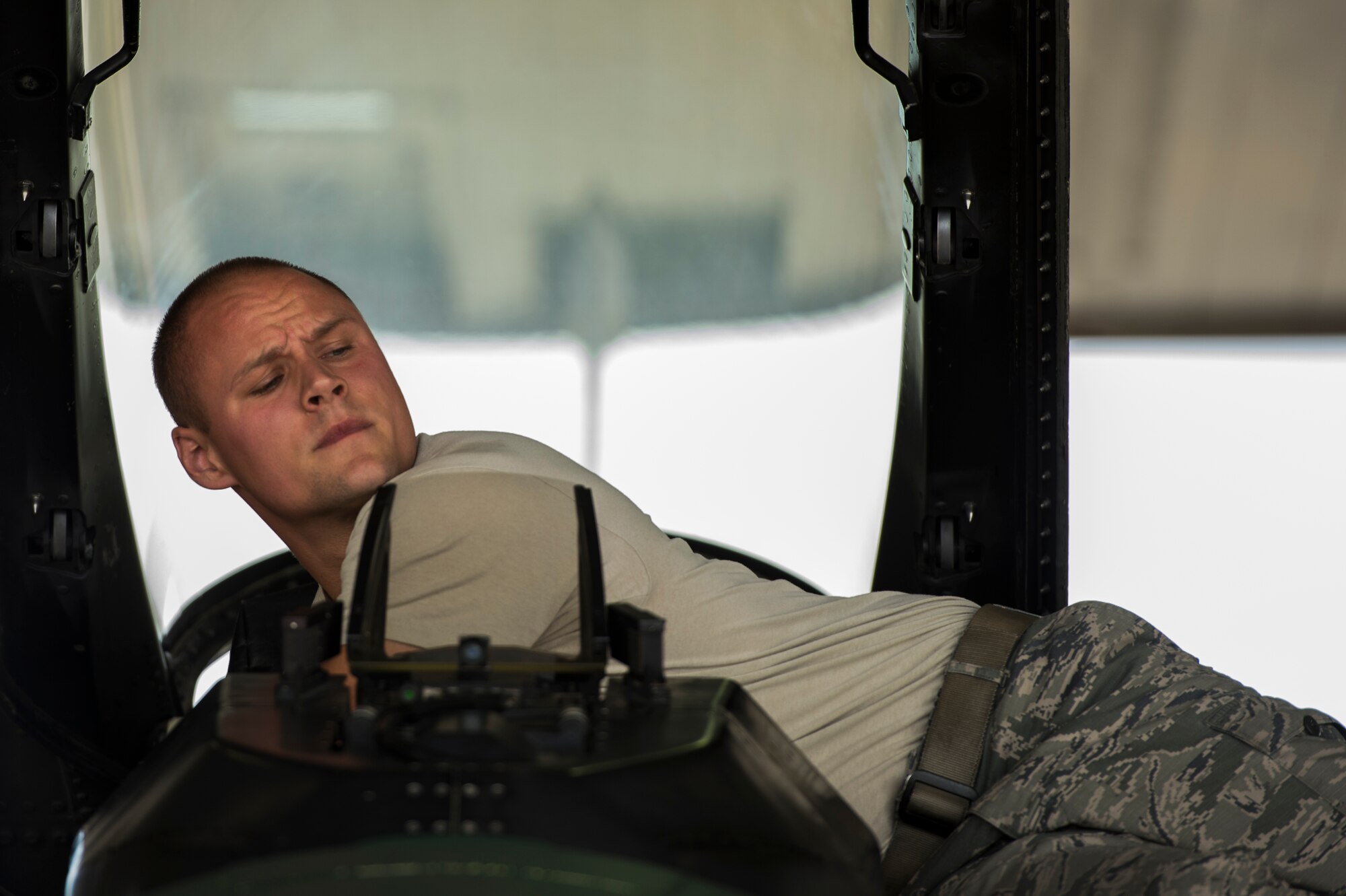 Staff Sgt. Jacob Lee, 354th Aircraft Maintenance Squadron weapons load crew, repairs the weapons systems on an F-16C Fighting Falcon at Eielson Air Force Base, Alaska, Aug. 4, 2014. The 354th AMS provides mission ready mission ready aircraft to support the wing's F-16 aggressor mission that includes home station, the exercise RED FLAG-Alaska and Aggressor road shows. (U.S. Air Force photo by Staff Sgt. Stephany Richards/ Released)
