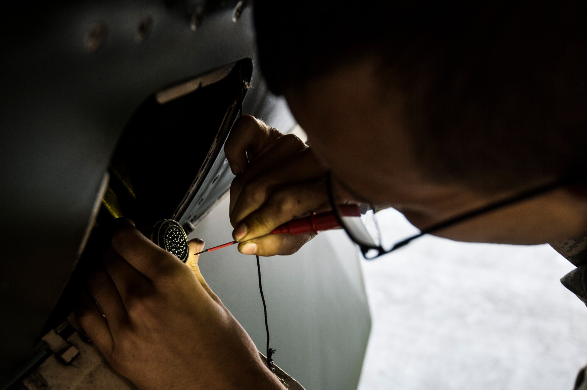 Senior Airman Jacob Hamblen, 354th Aircraft Maintenance Squadron engines specialist, inspects an F-16C Fighting Falcon before take-off at Eielson Air Force Base, Alaska, Aug. 4, 2014. The 354th AMS provides mission ready mission ready aircraft to support the wing's F-16 aggressor mission that includes home station, the exercise RED FLAG-Alaska and Aggressor road shows. (U.S. Air Force photo by Staff Sgt. Stephany Richards/ Released)