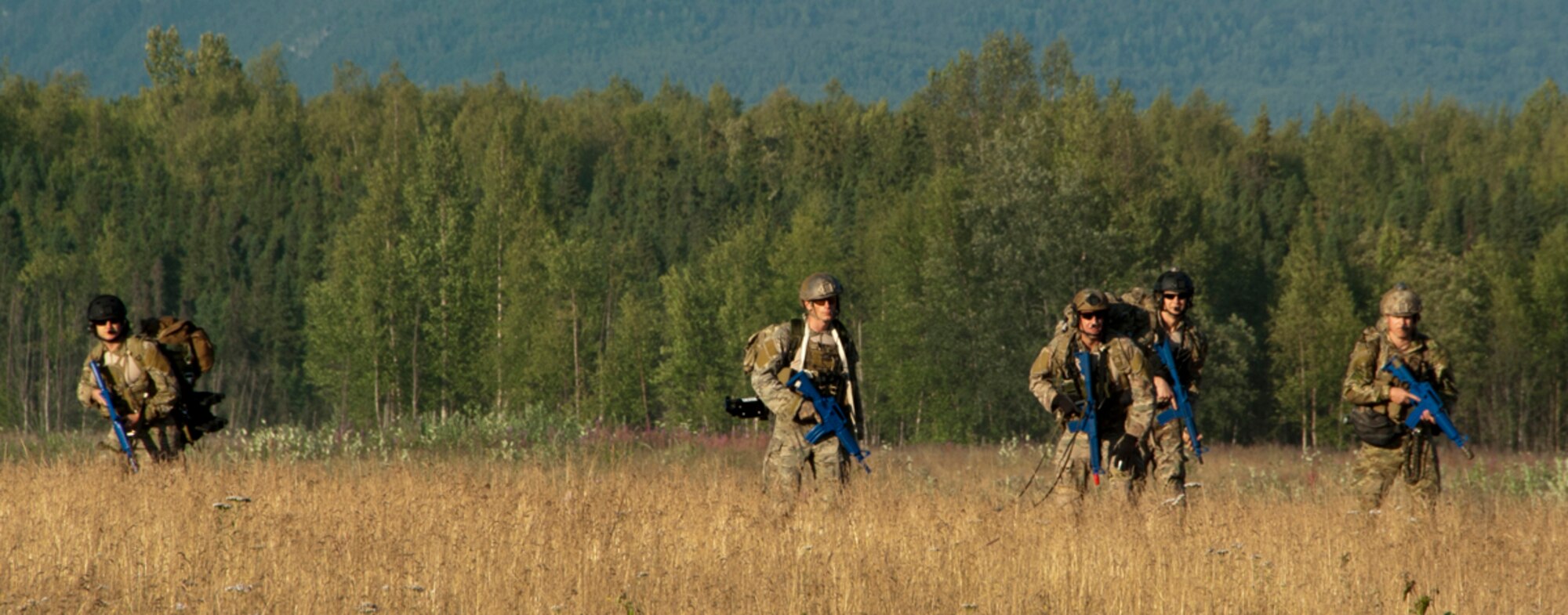A team of pararescuemen from the 212th Rescue Squadron conduct a routine training mission on Joint Base Elmendorf-Richardson, Alaska, July 30, 2014. The Rescue Squadron trains their team for any military and civilian missions where they may be tasked to recover, rescue or execute a medical evacuation. (U.S. Air Force photo/Airman 1st Class Tammie Ramsouer)