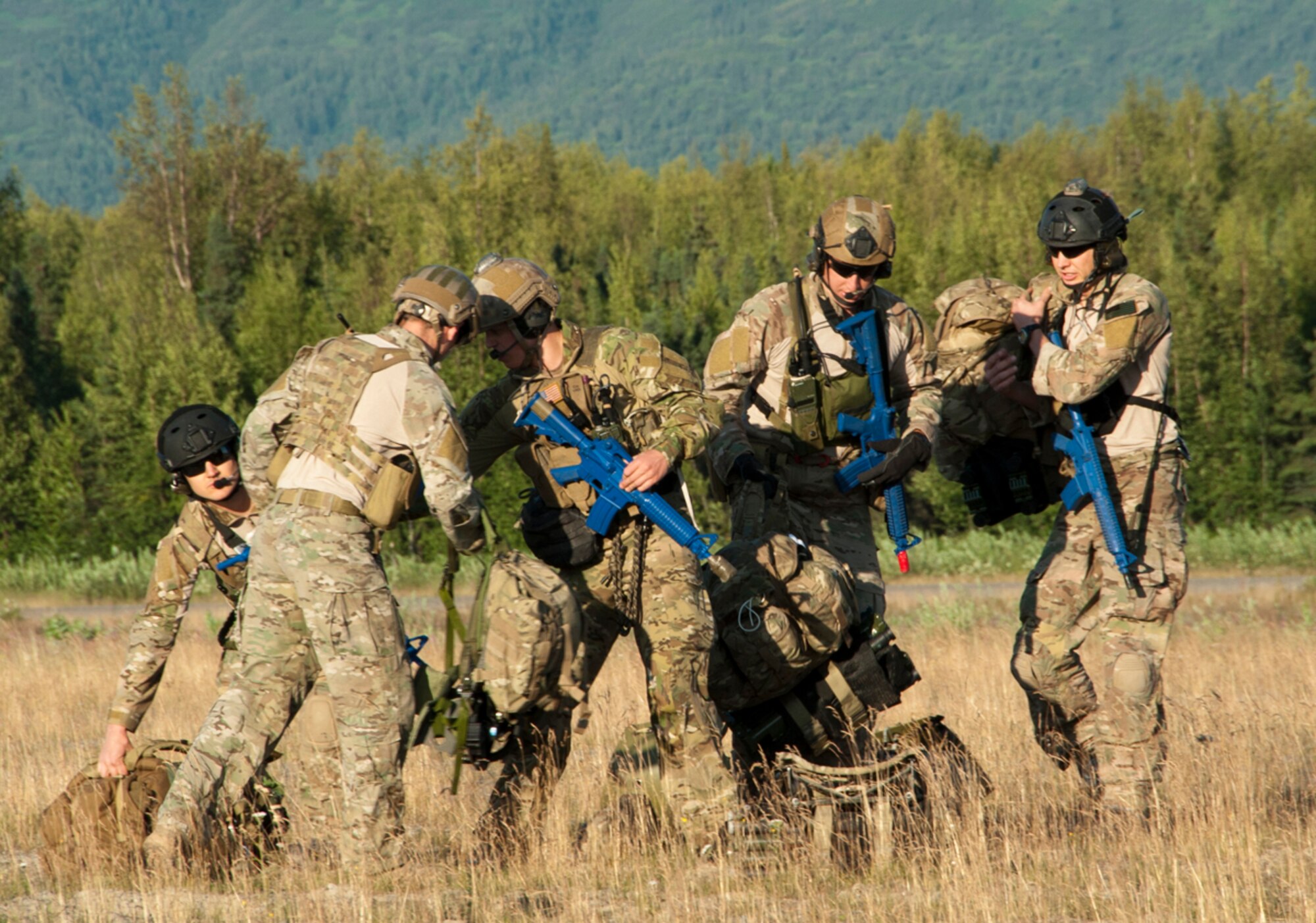 A team of pararescuemen from the 212th Rescue Squadron conduct a routine training mission on Joint Base Elmendorf-Richardson, Alaska, July 30, 2014. The Rescue Squadron trains their team for any military and civilian missions where they may be tasked to recover, rescue or execute a medical evacuation. (U.S. Air Force photo/Airman 1st Class Tammie Ramsouer)