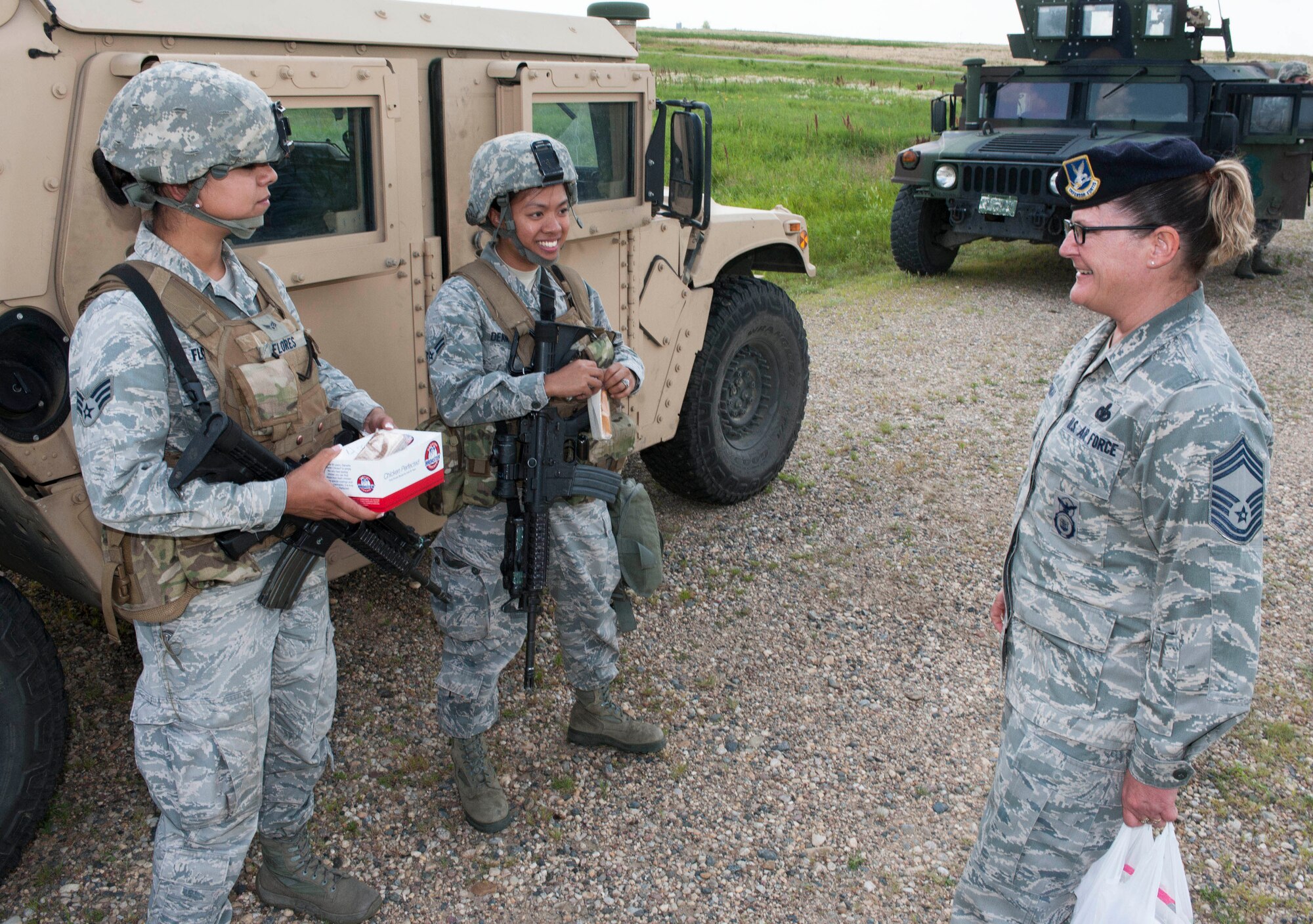 Chief Master Sgt. Melissa Permar, 791st Missile Security Forces Squadron security forces manager, speaks with Airmen from the 791st MSFS, during a morale visit to the missile complex in North Dakota, July 30, 2014. Permar stressed that post visits are an essential aspect of the job for several reasons: They allow leadership to build rapport with Airmen, increase their knowledge of each person's well-being, and get Airmen’s input on issues they may be having.(U.S. Air Force photo/Senior Airman Stephanie Morris)