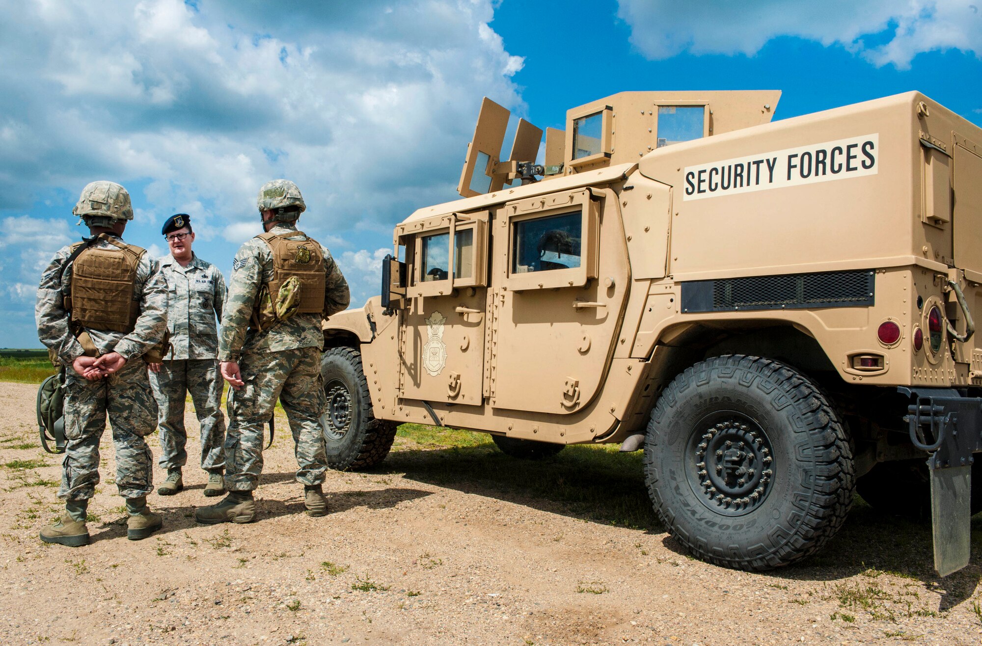 Chief Master Sgt. Melissa Permar, 791st Missile Security Forces Squadron security forces manager, speaks with 791st MSFS Airmen, during a morale visit to the missile complex in North Dakota, July 30, 2014. “When you go out to see the defenders and maintenance Airmen working together it’s very evident that they make a cohesive team,” Permar said. (U.S. Air Force photo/Senior Airman Stephanie Morris)