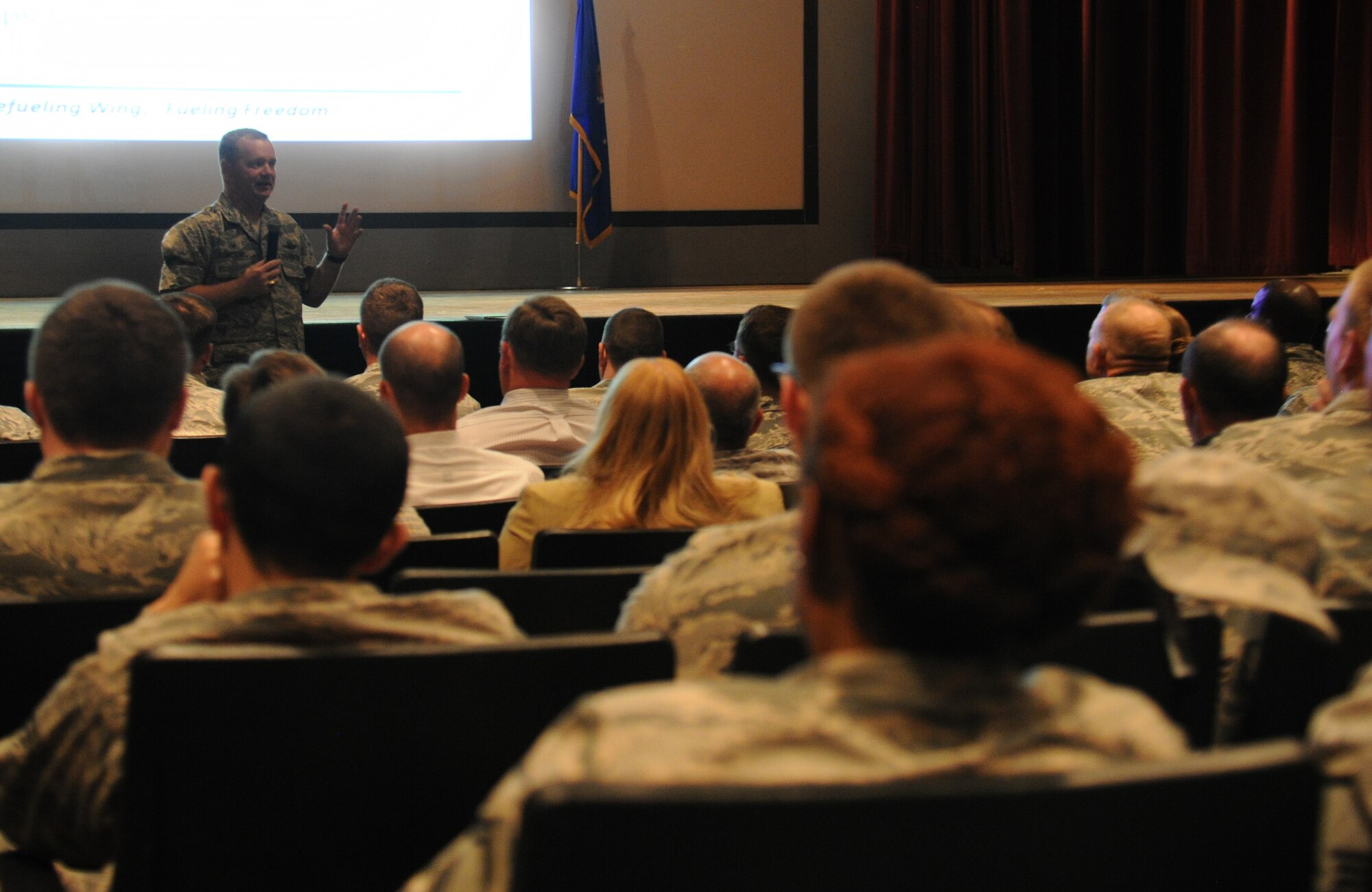 Col. Brian McDaniel, 92nd Air Refueling Wing commander, speaks with members of Team Fairchild in the base theatre at Fairchild Air Force Base, Wash., Aug. 5, 2014. McDaniel has recently assumed command of the 92nd. McDaniel will be the base commander for Fairchild for the next two years. (U.S. Air Force photo/Senior Airman Ryan Zeski)