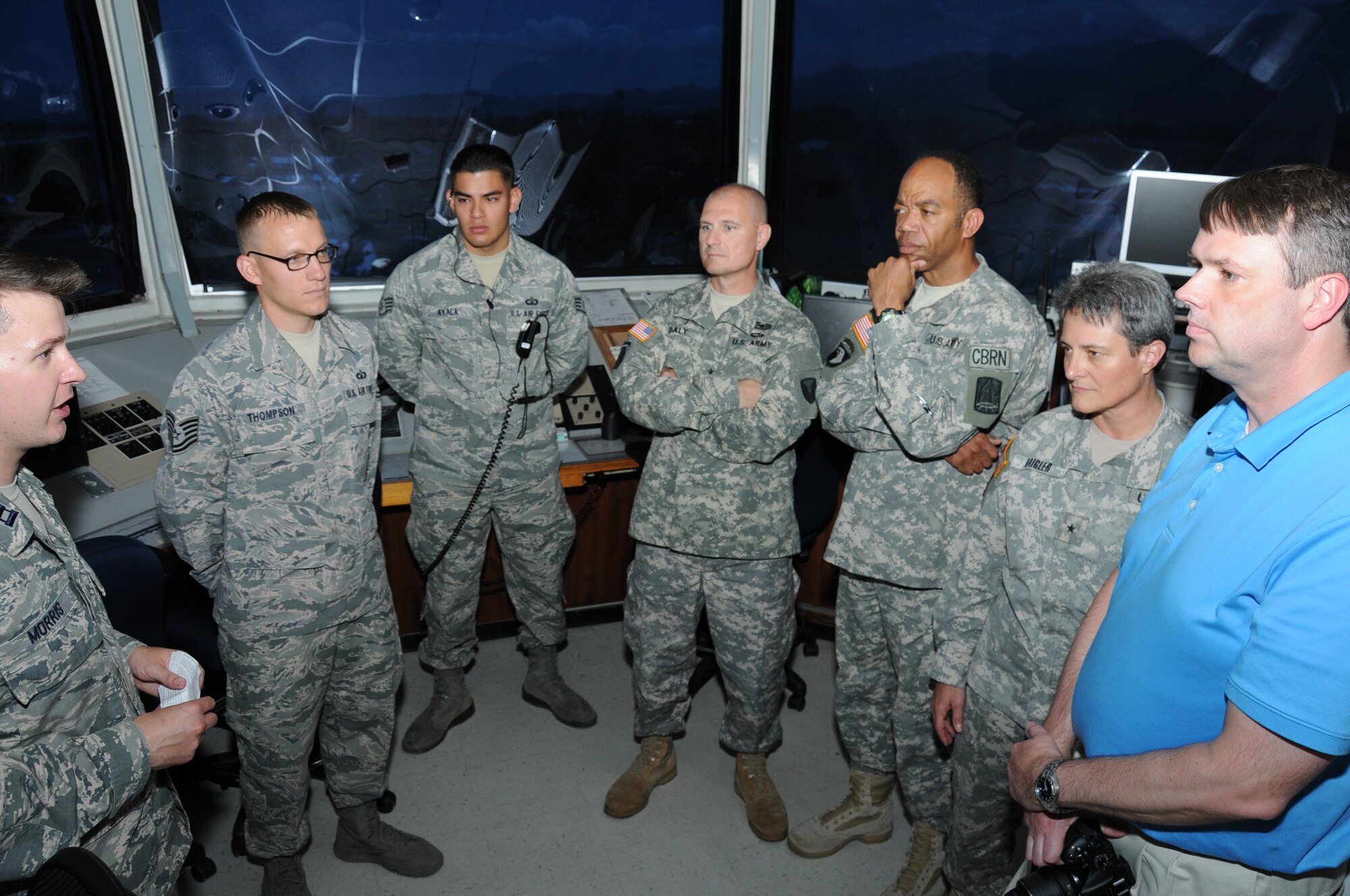 Four CAPSTONE members learn about the capabilities of the Soto Cano Air Base control tower, air field and runway from U. S. Air Force Capt. Michael Morris, 612th Operations Support Flight commander.  Fifteen general and flag officers from the National Defense University's (NDU) CAPSTONE class 14-4 toured and received capability briefs from Joint Task Force-Bravo and the major support commands during their overseas field study trip to Soto Cano Air Base, Honduras, August 2, 2014.  (Photo by U. S. Air National Guard Capt. Steven Stubbs)