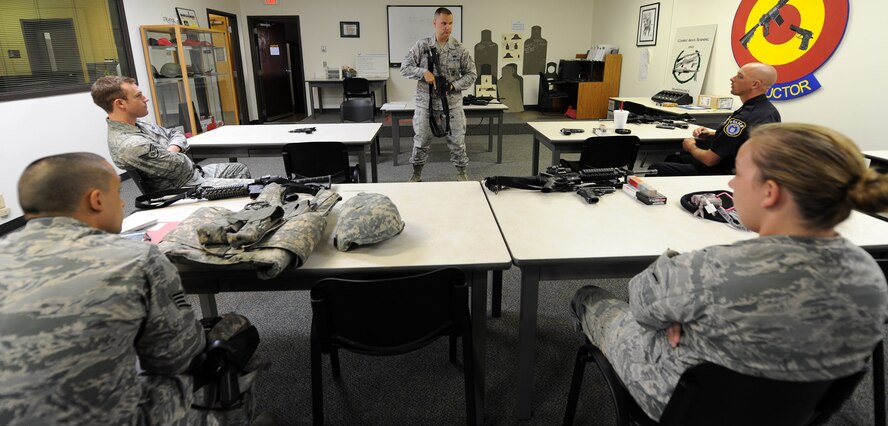 VANCE AIR FORCE BASE, Okla. -- Tech. Sgt. John King, the 71st Security Forces Squadron unit training manager, teaches Airmen Shoot, Move, Communicate procedures during a class July 28 at the Combat Arms Training Maintenance facility. King has been teaching Airmen here for three years. (U.S. Air Force photo/Staff Sgt. Nancy Falcon)