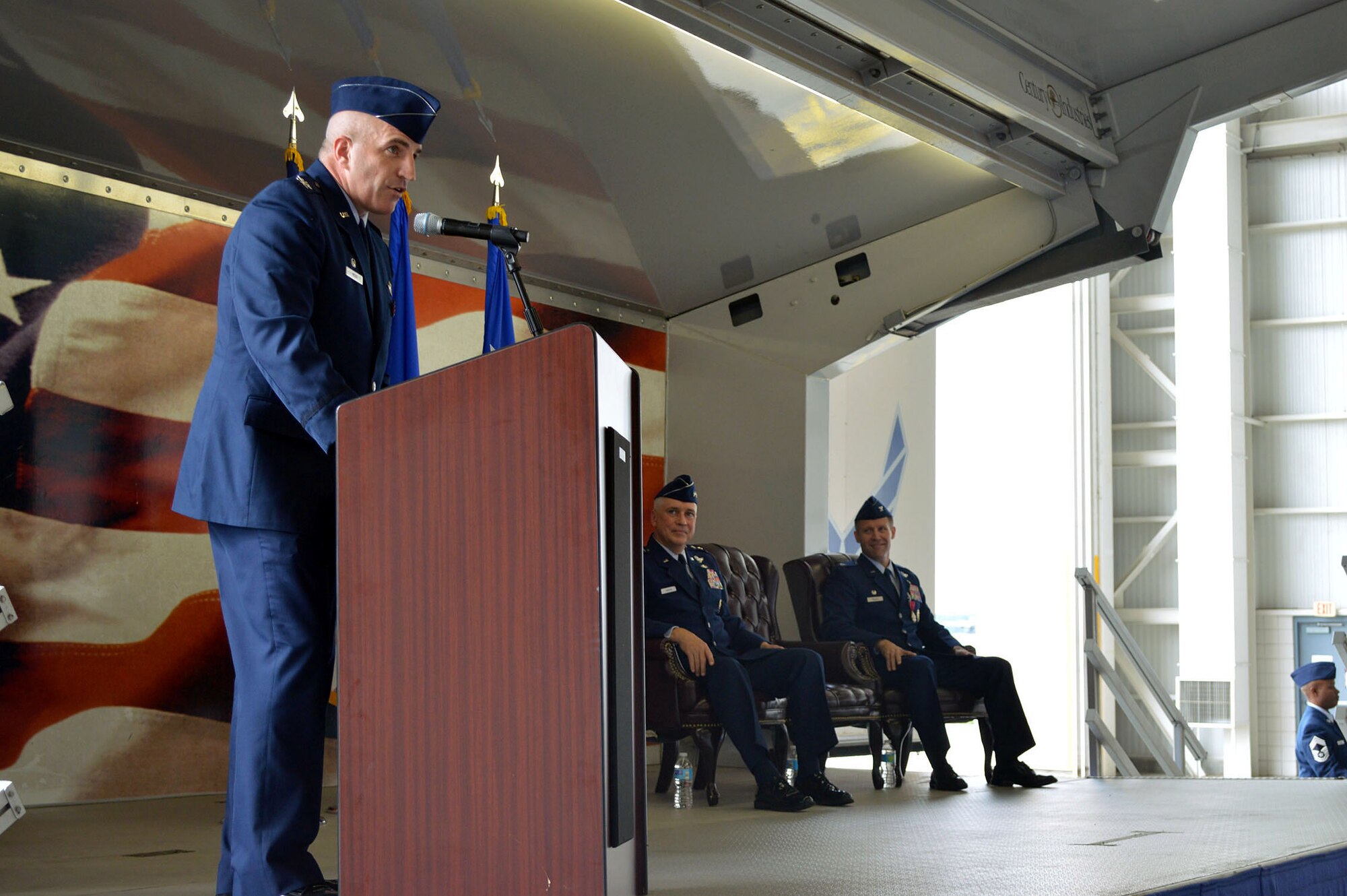 Col. Kenneth E. Moss, 43rd Airlift Group commander, gives his first speech as the new commander during a change of command ceremony August 5, 2014 at Pope Army Airfield, N.C. Prior to his current assignment, Moss was a fellow at the U.S. Navy Strategic Studies Group, in Newport, R.I. The outgoing commander, Col. Daniel H. Tulley, moves on to his next assignment as the commander for the 6th Air Mobility Wing, MacDill Air Force Base, Fla. (U.S. Air Force photo/Marvin Krause)