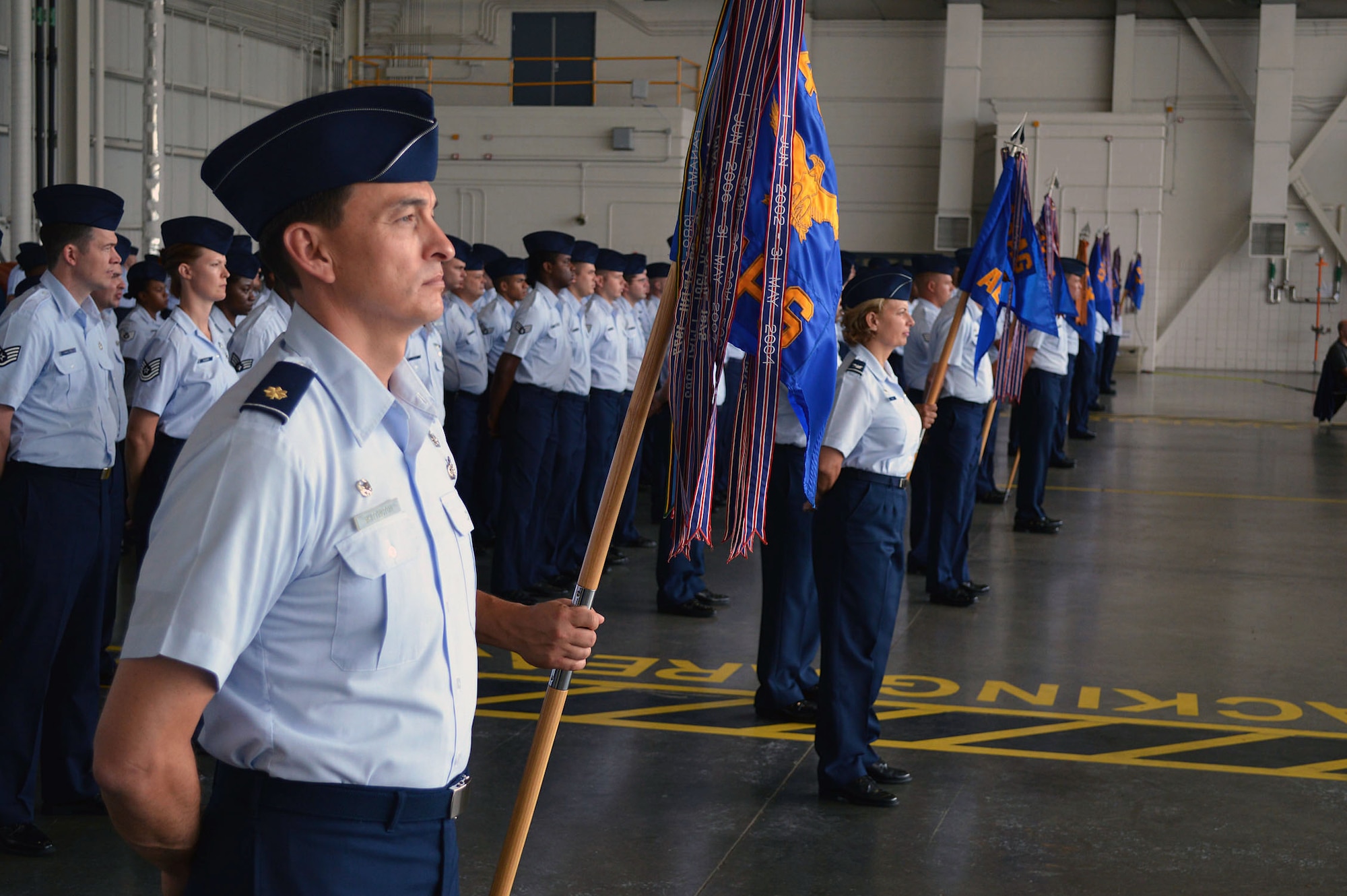43rd Airlift Group Airmen stand in formation during the 43rd AG’s change of command ceremony on Aug. 5, Pope Army Airfield. Col. Kenneth E. Moss, 43rd Airlift Group commander, took command from the outgoing commander, Col. Daniel H. Tulley, who moves on to his next assignment as the commander for the 6th Air Mobility Wing, MacDill Air Force Base, Fla. (U.S. Air Force photo/Marvin Krause)