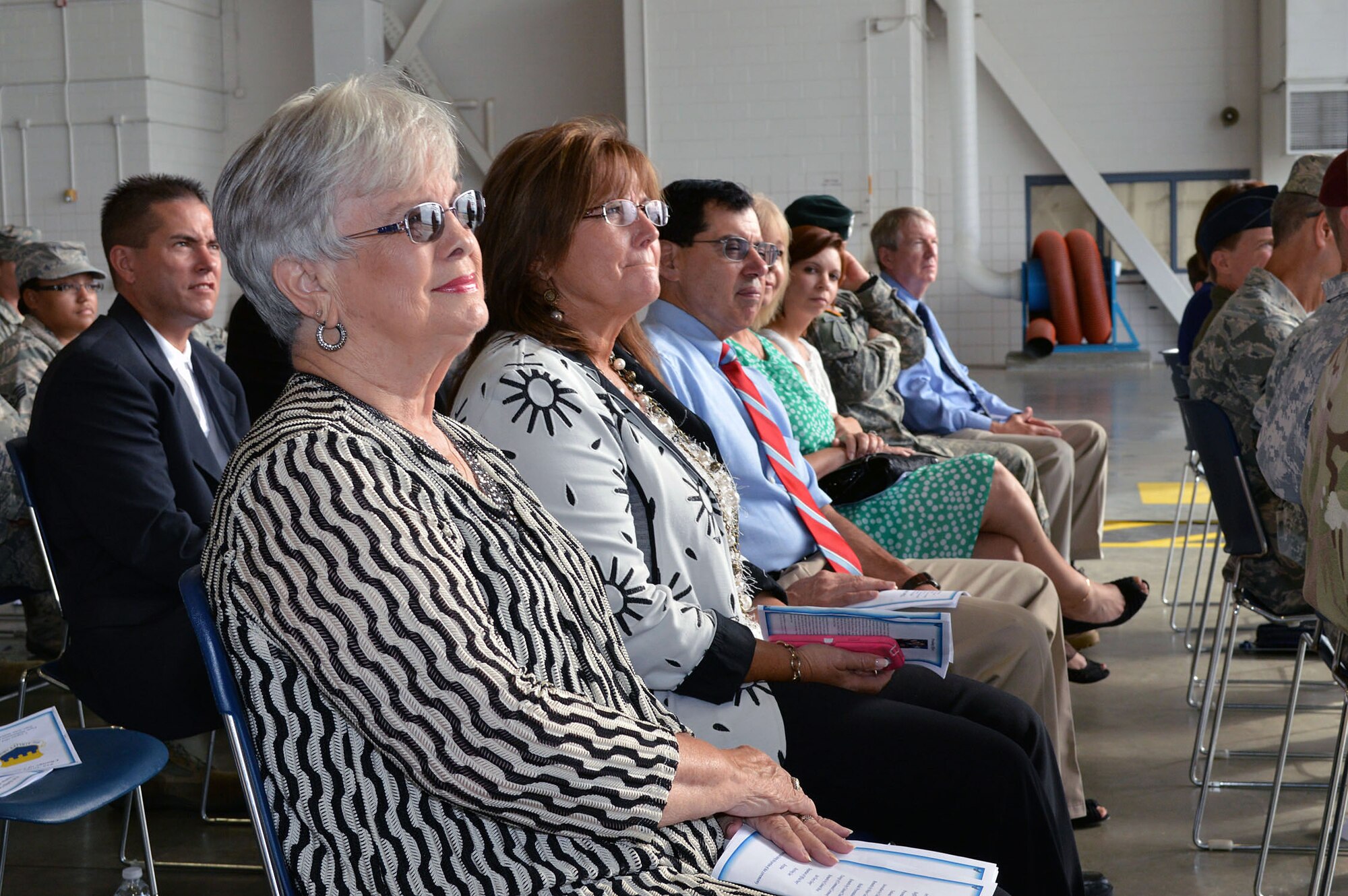 Mayor Patsy Carson from Erwin, N.C., and other local, civic and military leaders listen to comments provided by Col. Kenneth E. Moss, 43rd Airlift Group commander, during the 43rd Airlift Group’s change of command ceremony on Aug. 5, Pope Army Airfield. Moss took command from the outgoing commander, Col. Daniel H. Tulley, who moves on to his next assignment as the commander for the 6th Air Mobility Wing, MacDill Air Force Base, Fla. (U.S. Air Force photo/Marvin Krause)