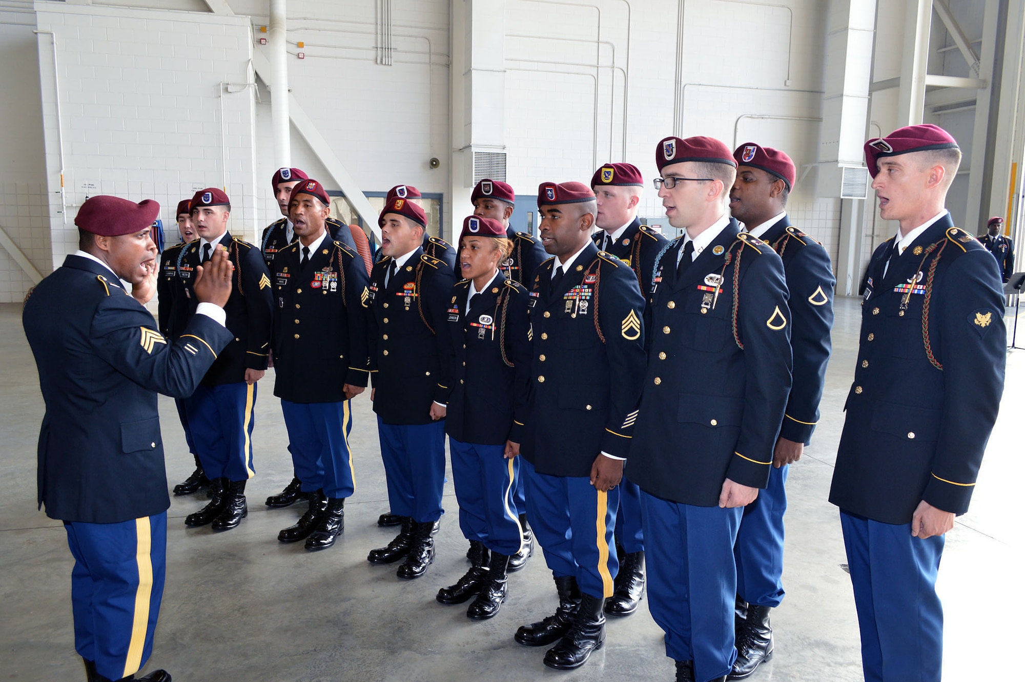 The 82nd Airborne Division All-American Chorus sings the national anthem during the 43rd Airlift Group’s change of command ceremony on Aug. 5 at Pope Army Airfield, N.C. Col. Kenneth E. Moss, 43rd AG commander, took command from the outgoing commander, Col. Daniel H. Tulley, who moves on to his next assignment as the commander for the 6th Air Mobility Wing, MacDill Air Force Base, Fla. (U.S. Air Force photo/Marvin Krause)