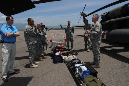 Fifteen general and flag officers from the National Defense University's (NDU) CAPSTONE class 14-4 learned about the various equipment used by the UH-60 Blackhawks and CH-47 Chinooks flown by the 1-228th Aviation Regiment to perform heavy lift, medical evacuation, fire fighting and general aviation support to counter narcotic and humanitarian assistance/disaster relief missions.  The group toured and received capability briefs from Joint Task Force-Bravo and the major support commands during their overseas field study trip to Soto Cano Air Base, Honduras, August 2, 2014.  (Photo by Martin Chahin)