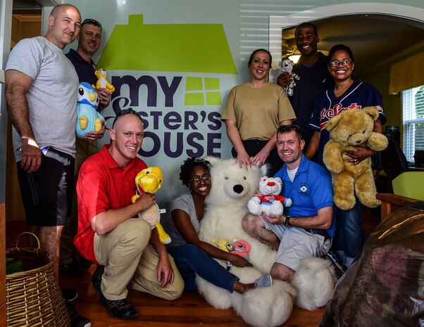 Master Sgt. Jeremy Klemme, 628th Logistics Readiness Squadron first sergeant, Master Sgt. Tony Crerar, 628th Civil Engineer Squadron first sergeant, Master Sgt. Travis Heath, 628th Communications Squadron first sergeant, Master Sgt. Eric Rainer, 628th Medical Group first sergeant, Master Sgt. Tim Wheelis, 14th Airlift Squadron first sergeant, Master Sgt. Kristy Beaudoin, 437th Maintenance Group first sergeant and Chief Master Sgt. Mauree Powell, 437th Aircraft Maintenance Squadron first sergeant, pose for a photo at ‘My Sister’s House’ after donating stuffed animals to the organization. The First Sergeant Council, along with help from Airman 1st Class Diedre Brown, from the 437th Maintenance Squadron, organized a Teddy Palooza Campaign in which Airmen from Joint Base Charleston donated hundreds of stuffed animals.   (U.S. Air Force photo/ Senior Airman Dennis Sloan)