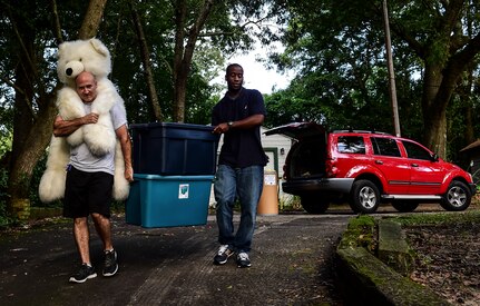 Master Sgt. Eric Rainer, 628th Medical Group first sergeant, and Master Sgt. Travis Heath, 628th Communications Squadron first sergeant, deliver stuffed animals to ’My Sister’s House,’ which  provides advocacy as well as therapy for women and children who have been victimized by domestic violence Aug. 5, 2014, in Charleston, S.C. The First Sergeant Council, along with help from Airman 1st Class Diedre Brown, from the 437th Maintenance Squadron, organized a Teddy Palooza Campaign in which Airmen from Joint Base Charleston donated hundreds of stuffed animals. (U.S. Air Force photo/ Senior Airman Dennis Sloan)