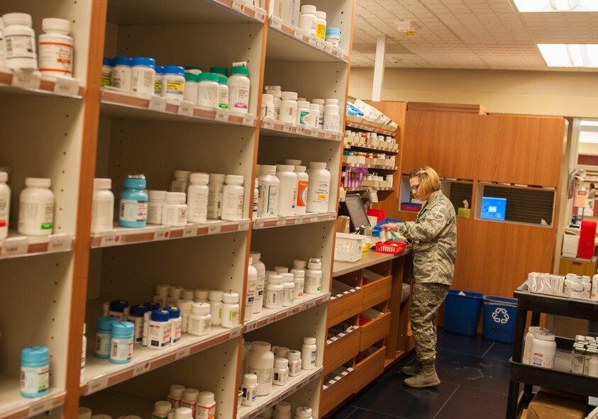 Airman 1st Class Hayley Martin, 5th Medical Support Squadron pharmacy technician, sorts medication on Minot Air Force Base, N.D., July 30, 2014. The pharmacy provides services to over 12,000 Minot AFB beneficiaries. (U.S. Air Force photo/Airman 1st Class Apryl Hall)