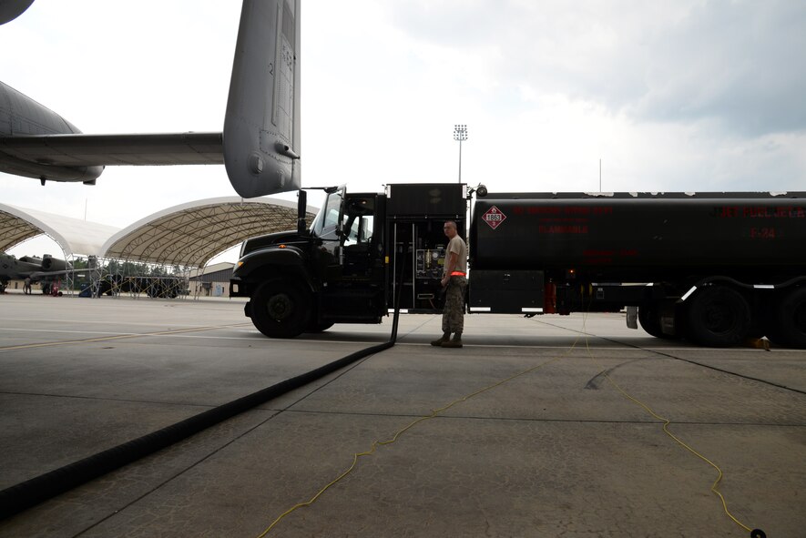 U.S. Air Force Senior Airman David Rhodes, 23d Logistics Readiness Squadron petroleum, oil and lubricants flight fuel distribution operator, pumps fuel in to an A-10C Thunderbolt II Aug. 1, 2014, at Moody Air Force Base, Ga. The POL flight is also responsible for providing fuel to the HC-130P Combat King and the HH-60G Pave Hawk. (U.S. Air Force photo by Staff Sgt. Eric Summers Jr./Released) 