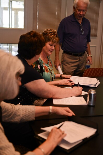 Barbara Corbett, Sumter Chamber of Commerce vice president of operations, speaks about an upcoming Military Appreciation Day Picnic with Susie Massey, the chamber director of communications during a meeting at the chamber, Sumter, S.C., Aug. 5, 2014. The picnic is organized by the chamber to show appreciation to all active duty military members on Shaw Air Force Base. The event will be a coordination effort between Sumter community, local businesses and the base, scheduled to be Sept. 26. (U.S. Air Force photo by Senior Airman Tabatha Zarrella/Released)