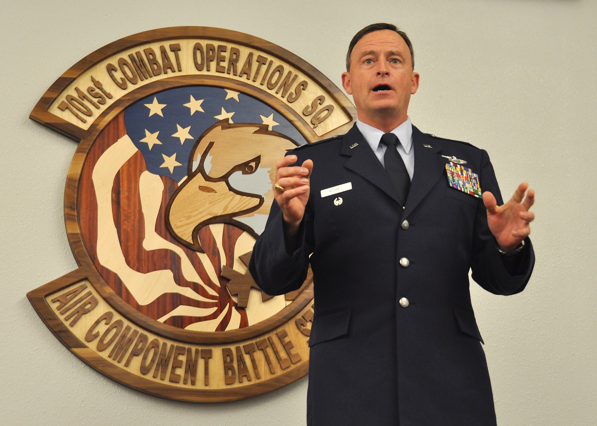 Col. James Kovac, 701st Combat Operations Squadron commander, speaks with his squadron for the first time right after his change of command ceremony, July 12, March Air Reserve Base, California. Kovac, who was previously assigned to the 701st COS for many years as the Air Component Coordination Element Director, took over command from Col. Paul Fast, the outgoing 701st COS commander. The 701st provides decisive airpower to support combatant commanders around the globe but specifically concentrates on the Korean theater of operations. The unit supports joint missions by using cyber-space and intelligence, surveillance and reconnaissance activities. (U.S. Air Force photo by Tech. Sgt. Heather Skinkle/released)