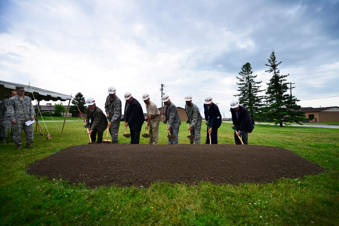 A ground-breaking ceremony is held here, August 5, 2014, for a C-130 Simulator which will be built on the installation and is estimated to bring over 450 students to the base each year as well as provide up to 18 full-time positions. (U.S. Air Force photo by Staff Sgt. Stephanie Sawyer)  