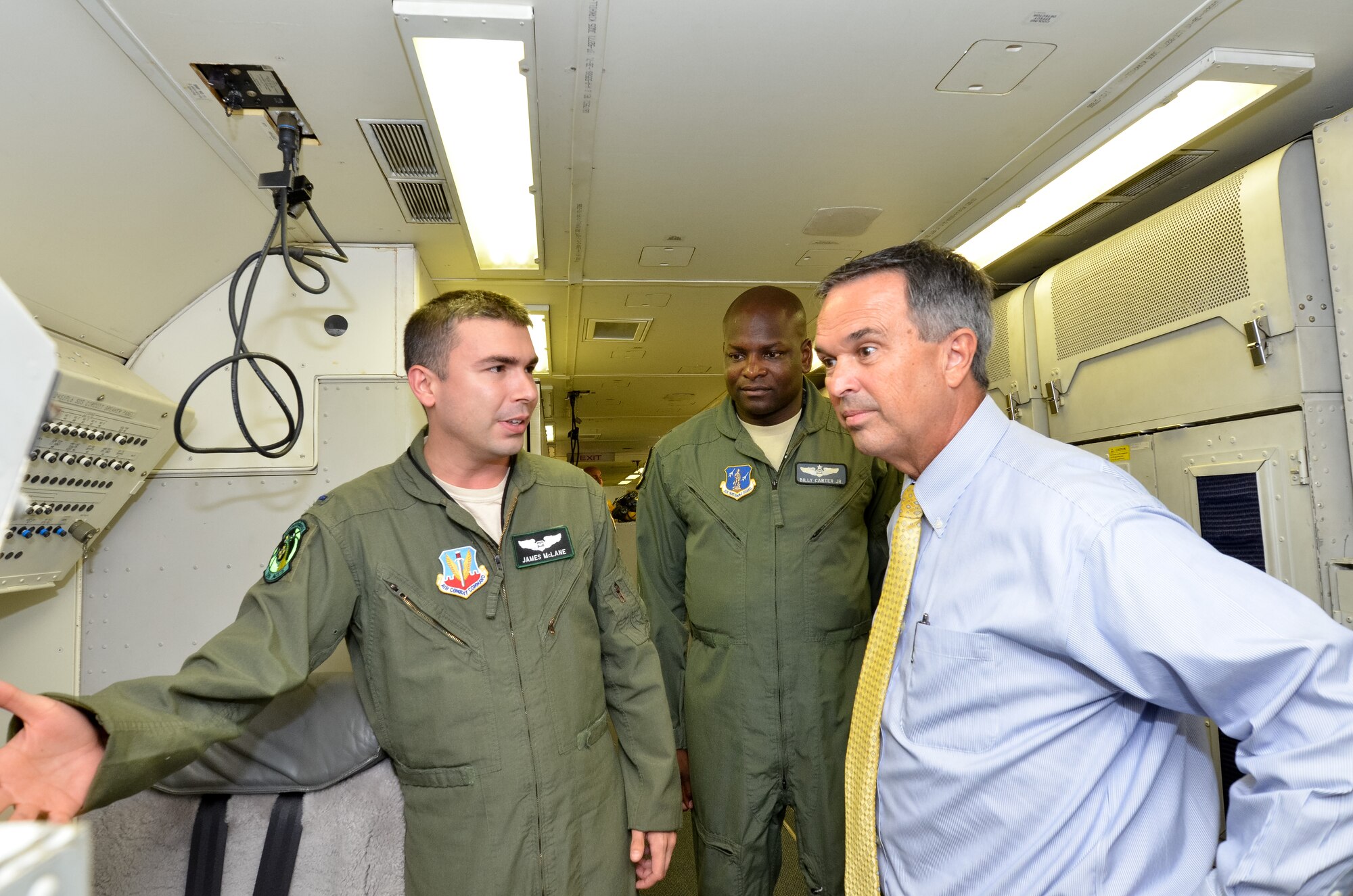 U.S. Air Force 1st Lt. James McClane, a navigator with the 12th Air Command 
and Control Squadron and Georgia Air National Guardsman Maj. Billy Carter, an 
instructor navigator with the 128th Air Command and Control Squadron brief the 
Honorable Randy Toms, Mayor of Warner Robins, Georgia, on the navigation 
system of the E-8C Joint Stars, during a visit to Robins Air Force Base, 
Georgia, Aug. 5, 2014.  The purpose of the visit was to orient the mayor with 
the JSTARS mission and introduce him to the men and women who comprise Team 
JSTARS.  (U.S. Air Force photo by Tech. Sgt. Julie Parker/Released)
