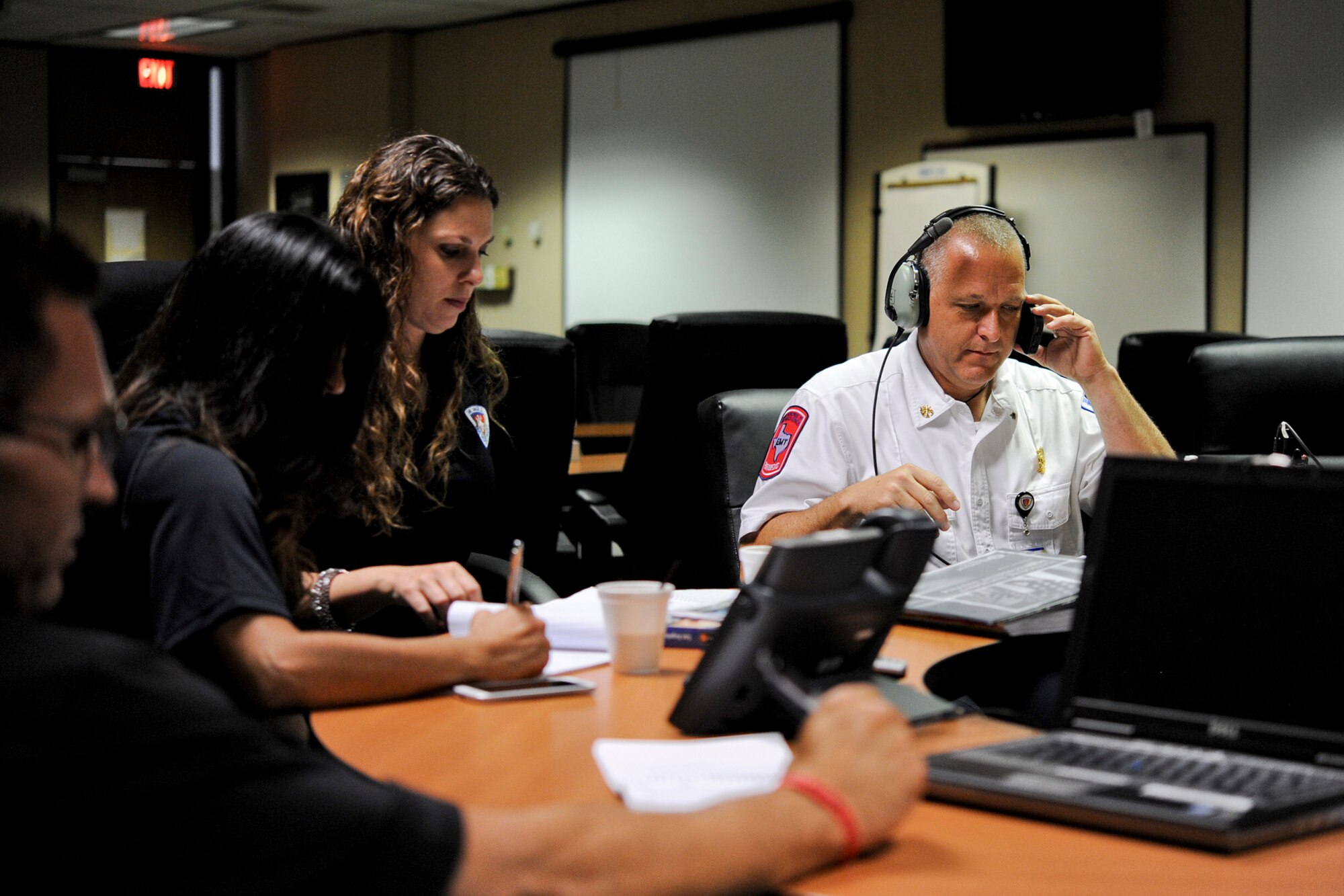 SAN ANGELO, Texas – Emergency Operations Center personnel participate in a military and civilian joint training exercise at Mathis Field July 31. The EOC is responsible for gathering data involved with the emergency and making decisions that protect life and property. After the decisions are made, the EOC then disperses those decisions to all concerned agencies and individuals. (U.S. Air Force photo/ Airman 1st Class Devin Boyer)