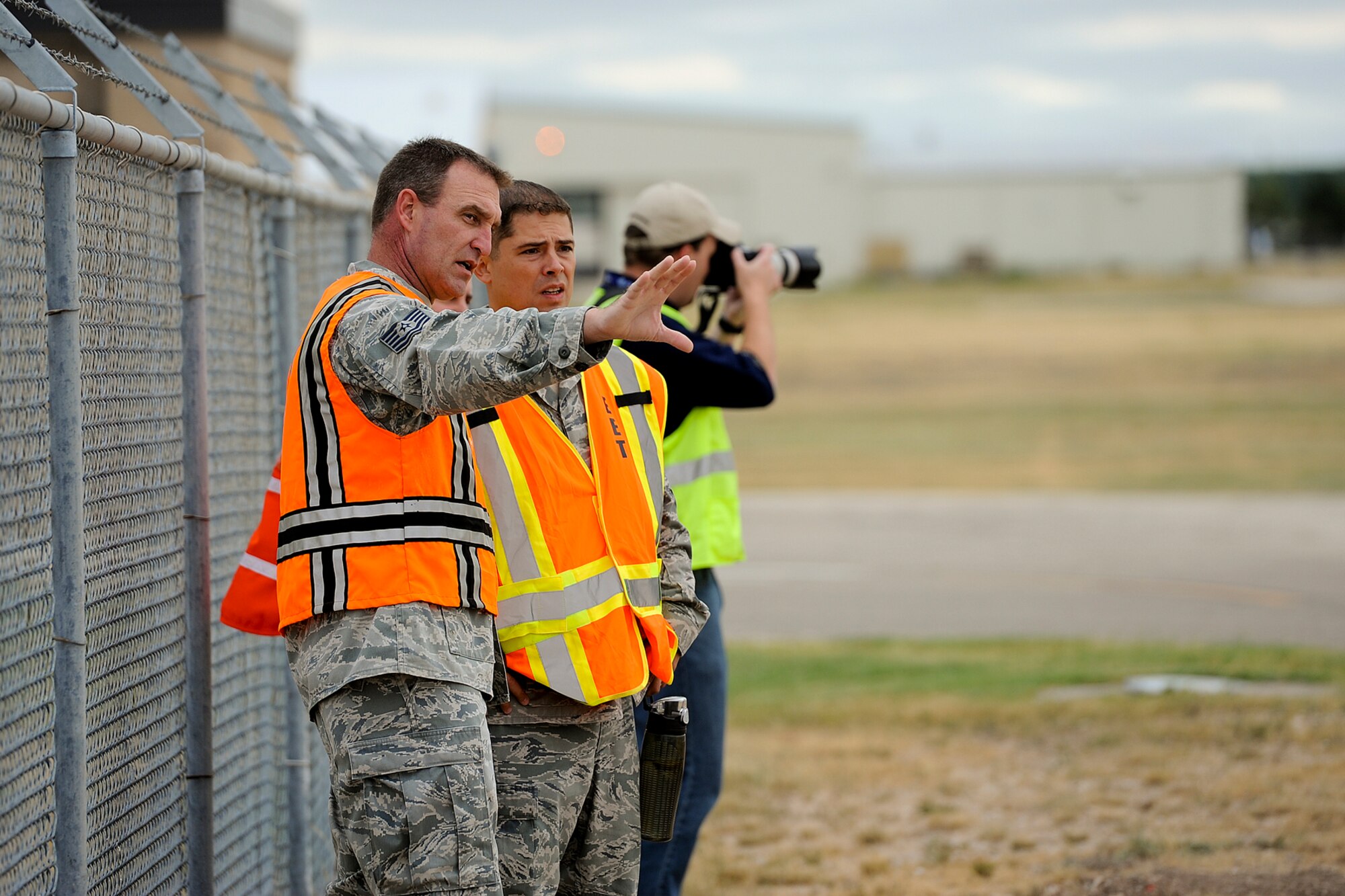 SAN ANGELO, Texas – Tech. Sgt. James B. Fountain and Staff Sgt. Charles Ladnier, 17th Training Wing Safety Office, observe a military and civilian joint training exercise at Mathis Field July 31. Fountain and Ladnier’s role was to make sure the exercise was performed in a safe manner. (U.S. Air Force photo/ Airman 1st Class Devin Boyer)