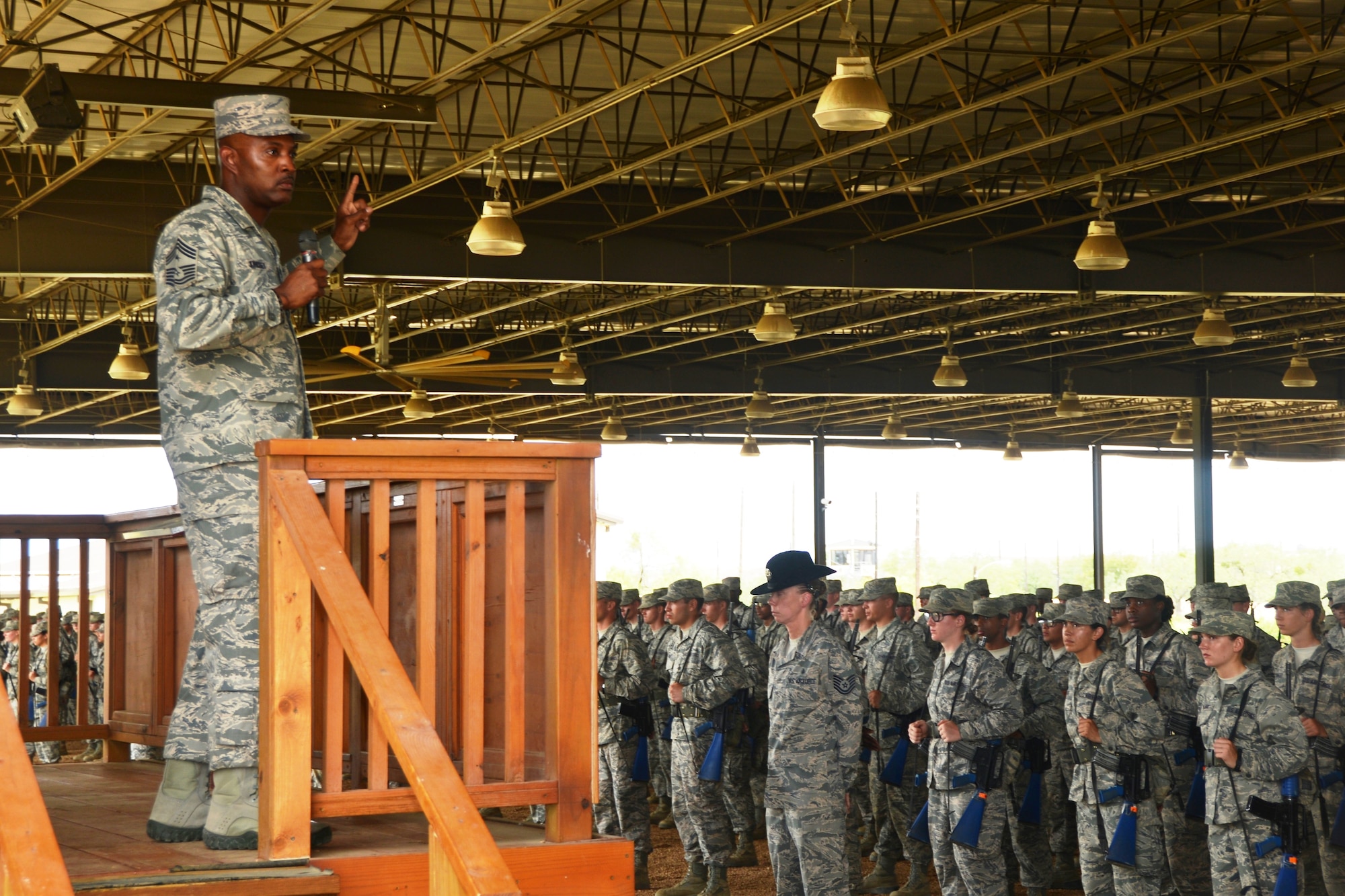 Command Chief Master Sgt. Cameron Kirksey, Air Force Reserve Command, Robins Air Force Base, Georgia, addresses over 500 hundred basic trainees, Aug.1, 2014 at the Culmex (culmination) Ceremony, on their last day of training at the “BEAST,” the Basic Expeditionary Airman Skills Training portion of Basic Training (U.S. Air Force photo by Minnie Jones)