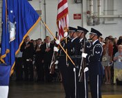 Members of the 911th Airlift Wing Honor Guard stand at the position of present arms during the singing of the national anthem during the Change of Command ceremony at the Pittsburgh International Airport Air Reserve Station, Aug. 3, 2014. (U.S. Air Force photo by Staff Sgt. Brandy Grace)