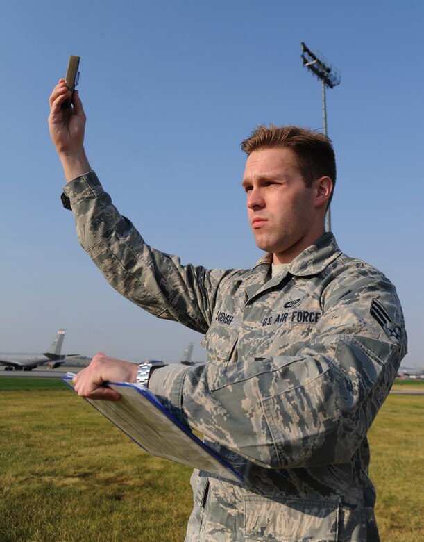 Senior Airman Andrew Dudish takes a manual weather observation using a Kestrel Weather Meter at Fairchild Air Force Base, Washington, Aug. 5, 2014. A Kestrel Weather Meter is a handheld wind and weather meter that provides the speed of the wind, the temperature, humidity and heat stress information. The 92nd Operations Support Squadron Airmen use the Kestrel daily to ensure accurate weather forecasts. Dudish is a 92nd OSS weather forecaster. (U.S. Air Force photo by Airman 1st Class Janelle Patiño/Released)