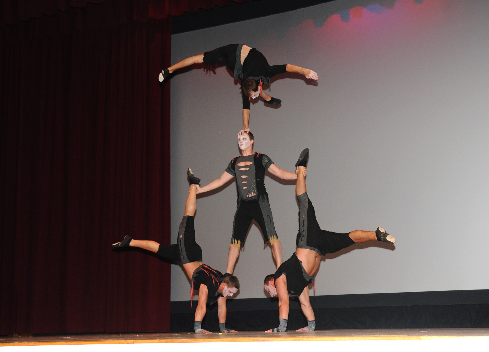Saltoriya performers, a four-man act combining hand balancing and dance, demonstrate their talent during a military appreciation show Aug. 1, 2014, at the Welch Theater, Keesler Air Force Base, Miss.  Saltoriya features some of the best international aerialists and artists who perform gravity-defying feats. (U.S. Air Force photo by Kemberly Groue)