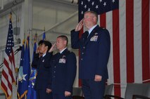 Maj. Gen. Stayce D. Harris, Col. Craig C. Peters and Col. Jeffrey Van Dootingh salute the flag during the playing of the national anthem during the Change of Command ceremony at the Pittsburgh International Airport Air Reserve Station, Aug. 3, 2014. (U.S. Air Force photo by Senior Airman Marjorie Bowlden)