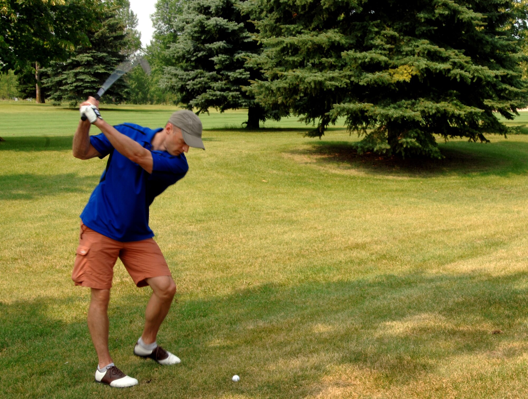Col. Robert Cook, 319th Air Base Wing vice commander, prepares to take his shot at the Grand Forks Country Club July 31, 2014, just outside of the city of Grand Forks, N.D. hosted by the Grand Forks Military Affairs Committee. The MAC tournament held in Grand Forks by the Chamber of Commerce and the complementary tournament at the Plainsview Golf Course on Grand Forks Air Force Base have been a standing tradition for more than 20 years. (U.S. Air Force photo/Staff Sgt. Susan L. Davis)