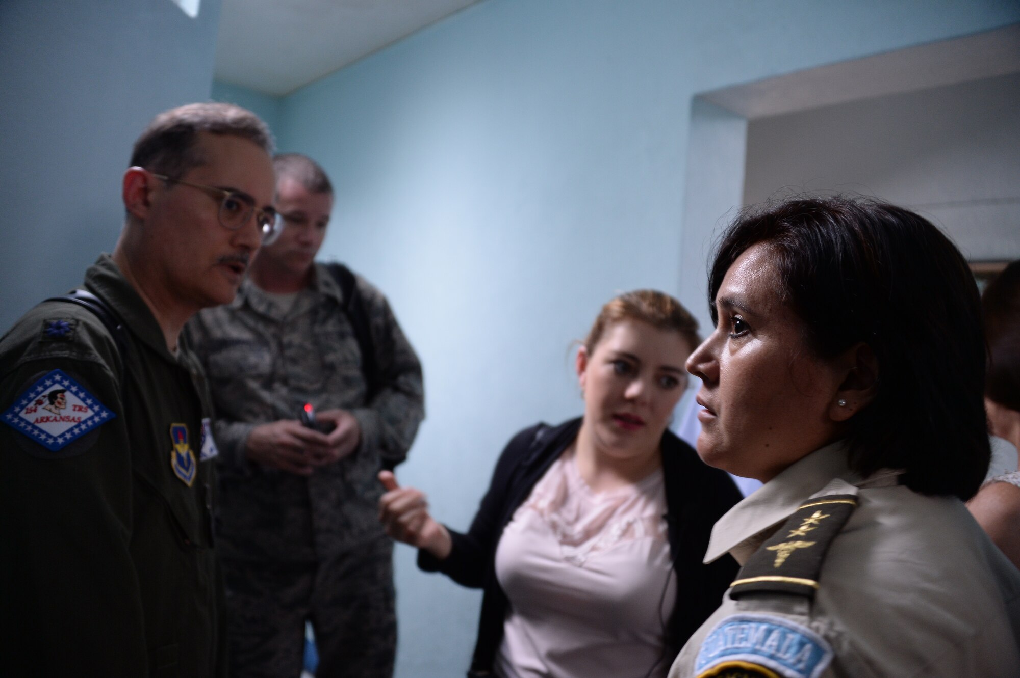 Col. Veronica Dono, nurse with the Guatemalan air force gives a tour of the hospital to members of Arkansas Air National Guard, and 12th Air Force (Air Forces Southern) during a subject matter expert exchange in Guatemala City, Guatemala, Aug. 4, 2014.  The visiting members wanted to look at the facilities to better understand the needs of the Guatemalan air force.  (U.S. Air Force photo by Tech. Sgt. Heather R. Redman/Released) 