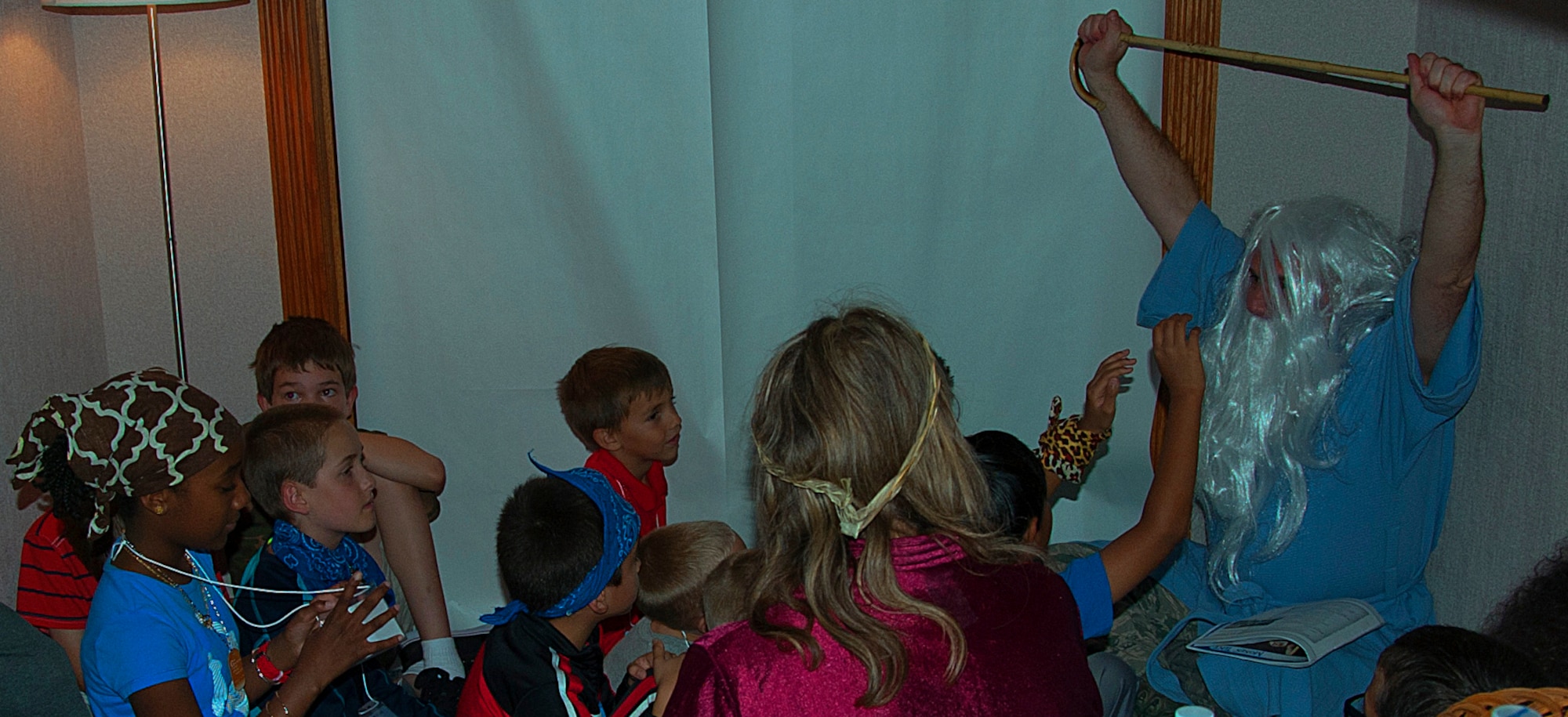 140730-F-GZ967-041 Chaplain (Lt. Col.) Joshua Narrowe, 90th Missile Wing chaplain, speaks to children on the history of Moses during a Vacation Bible School July 30, 2014, in the Chapel Activities Center F.E. Warren Air Force Base, Wyo. The school focused on introducing the children to various passages from the Bible. (U.S. Air Force photo by Airman 1st Class Brandon Valle)