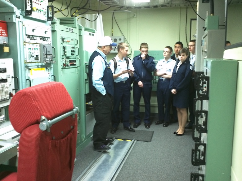PETERSON AIR FORCE BASE, Colo. — Ron Solomon, a Peterson museum volunteer docent, explains the workings of the museum's Missile Procedures Trainer exhibit to a group of Air Force Junior ROTC cadets from Air Academy High School. The MPT was used by the Air Force to train and evaluate missile launch control center crews supporting the "Peacekeeper" ICBM. (U.S. Air Force photo)