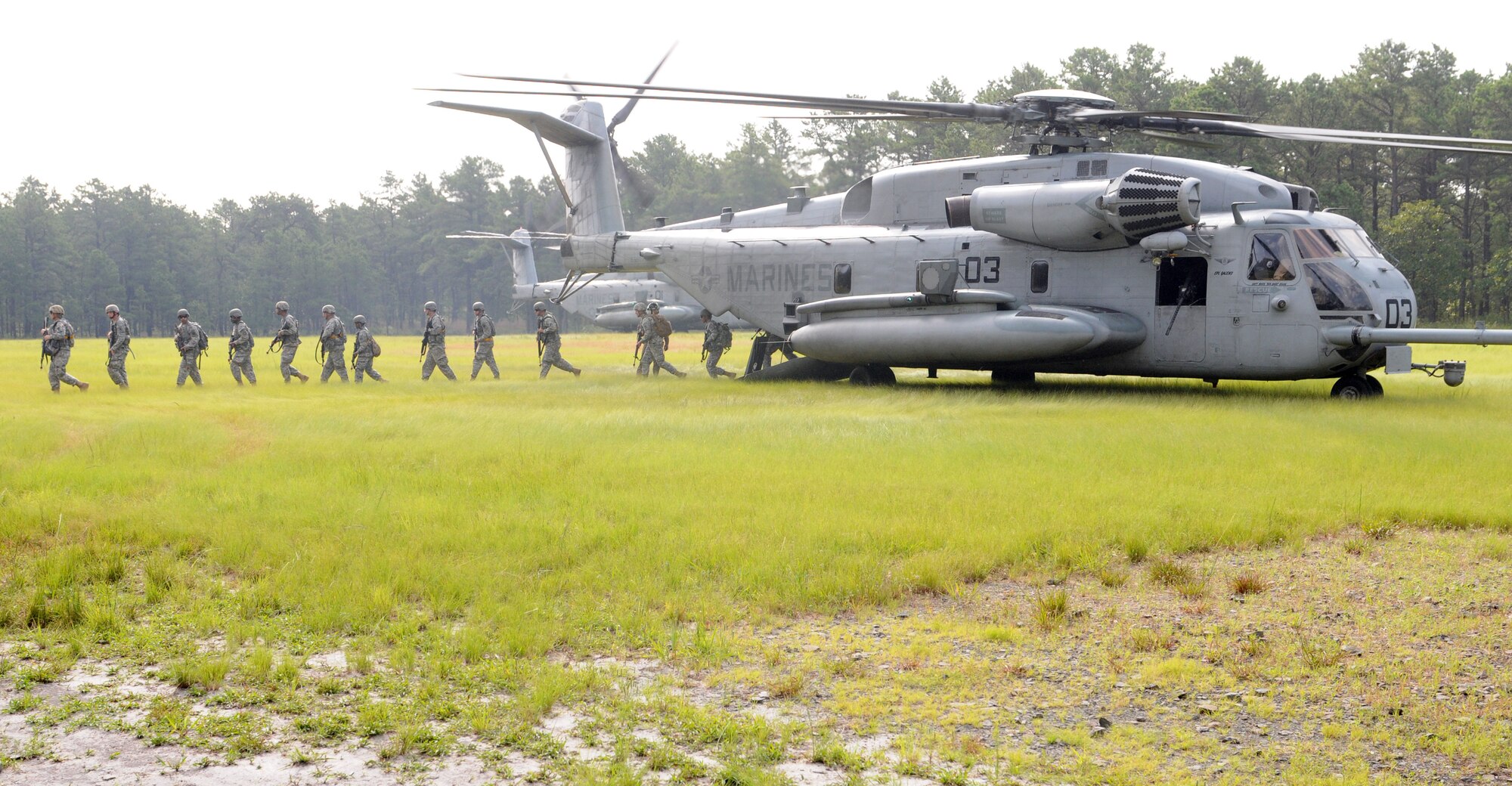 Charlie Company Soldiers exit two CH-53E Super Stallions from Marine Aircraft Group 49 during the final mission of the Operation Sustainment Warrior July 31, 2014, at Joint Base McGuire-Dix-Lakehurst, N.J. As the winning team for OSW 2014, they won the airlift to their vehicles and proceeded to conduct convoy lane missions where they engaged opposing force trainers. These missions and events in OSW are designed to refresh basic Soldier skills and promote retention. (U.S. Army photo by Spc. C. Terrell Turner/Released)