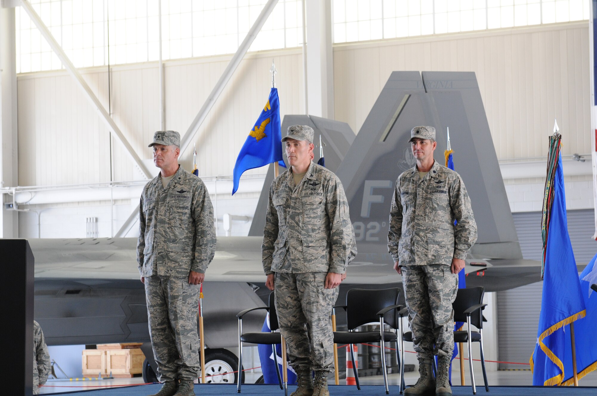 U.S. Air Force Col. Robert. J. Grey, 192nd Fighter Wing commander, presents the 192nd Maintenance Group colors to Lt. Col. Stephen H. Bunting to signify his assumption of command of the 192nd MXG, during a change of command ceremony held July 13, 2014 at Joint Base Langley-Eustis (U.S. Air National Guard photo by Tech. Sgt. Meghan Skrepenski/Released)