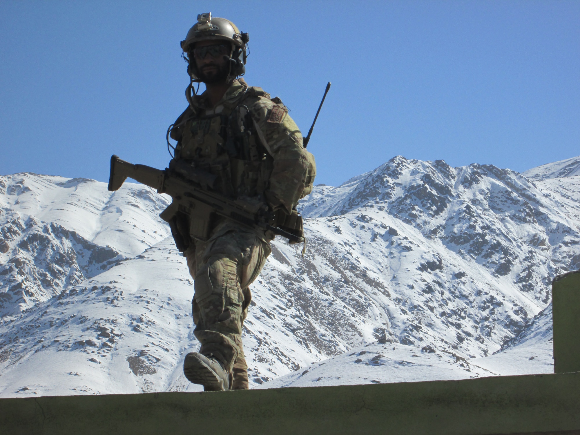 Master Sgt. Delorean Sheridan, a combat controller assigned to the 21st Special Tactics Squadron, stands on a roof top to get a good look at the incoming weather while deployed to Afghanistan in 2012. Sheridan was named as one of the 12 Outstanding Airmen of the Year for 2014. (Courtesy photo)