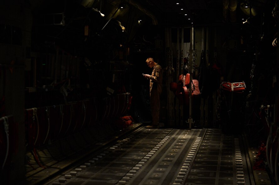 U.S. Air Force Senior Airman Korey King, 774th Expeditionary Airlifit Squadron loadmaster performs pre-flight inspections on a C-130J Super Hercules aircraft at Bagram Airfield, Afghanistan Aug. 1, 2014.  The squadron completed an airdrop for the Afghan National Army using the new Wireless Gate Release System.  The WGRS helps keep loadmasters safe and saves the Air Force money in material costs.  King is deployed from Dyess Air Force Base, Texas and a native of Hudson, Fla. (U.S. Air Force photo by Staff Sgt. Evelyn Chavez/Released)