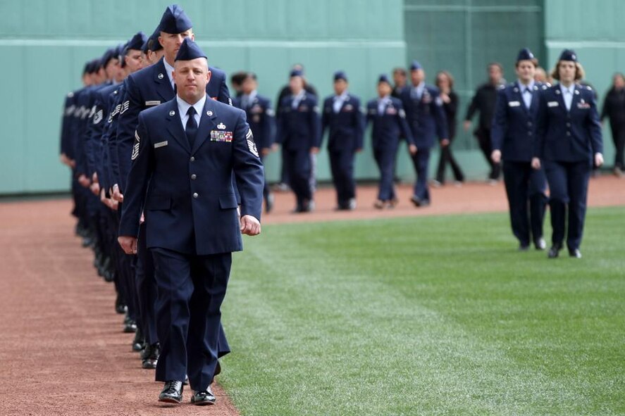 BOSTON -- Senior Master Sgt. Jeffrey N. Trudeau, 157th Logistics Readiness Squadron Fuels Management Flight superintendent, leads a group of Airmen on to the field at Fenway Park during a Boston Red Sox baseball games in 2013. Trudeau was recently notified that he was selected as the Gen. Lew Allen Jr. Award winner. Courtesy photo)