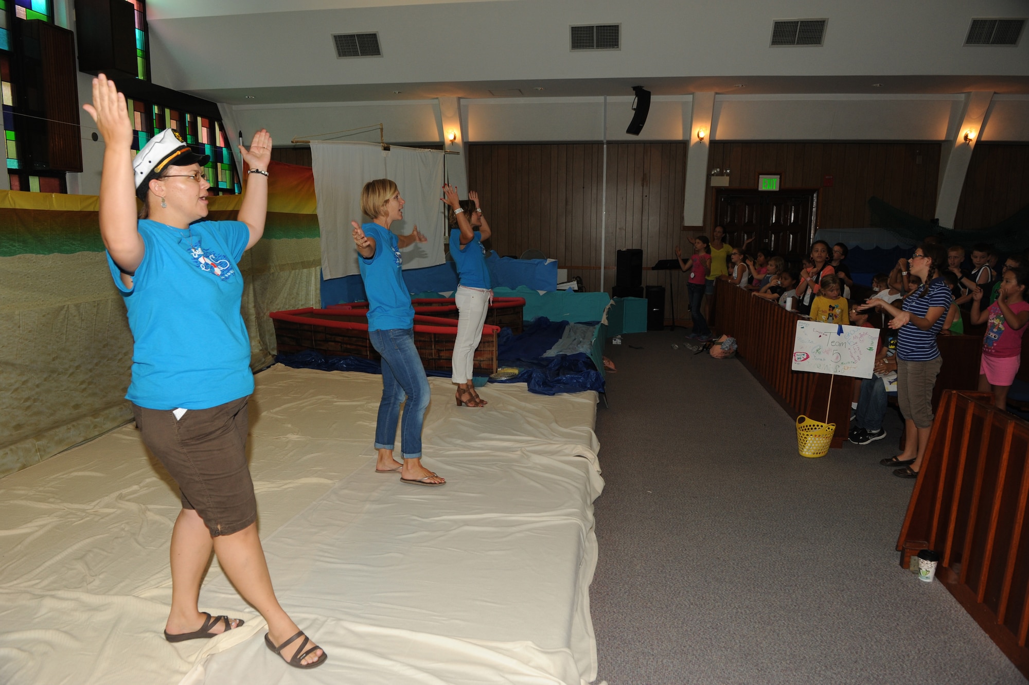 Vacation Bible School teachers show students how to perform a dance to the song He’s Big, Aug. 5, 2014, at Chapel 3 on Kadena Air Base, Okinawa, Japan. The students spent the day playing games, making crafts, singing songs, and learning about God. Vacation Bible School helps Airmen and their families by keeping them spiritually ready for the military lifestyle and helps boost the morale of children whose parents are deployed or on temporary duty.  (U.S. Air Force photo by Airmen 1st Class Stephen G. Eigel)