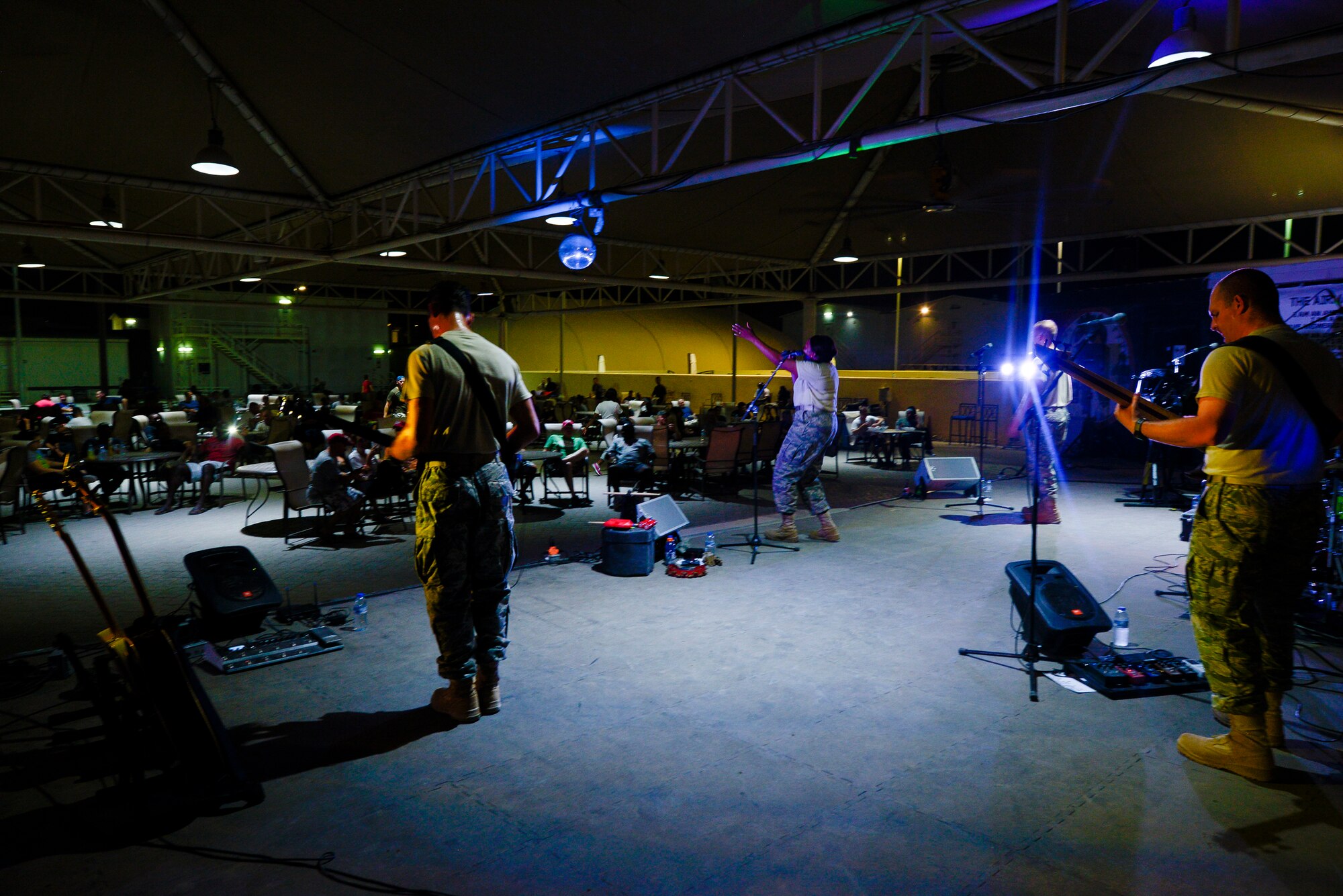 The U.S. Air Force Central Command Band performs for Airmen at the Thirsty Camel July 31, 2014, at an undisclosed location in Southwest Asia. The seven-member band spent three days here entertaining service members. (U.S. Air Force photo by Tech. Sgt. Russ Scalf/Released)