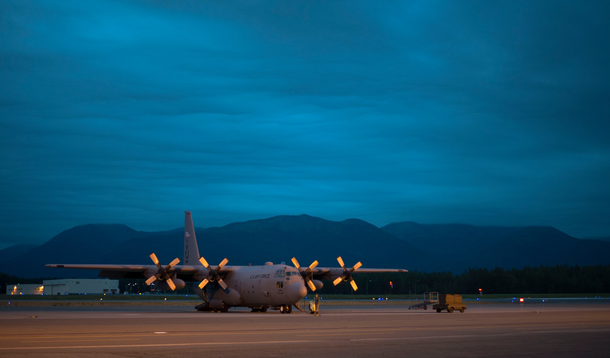 A C-130 Hercules from the 36th Airlift Squadron sits on the flight line prior to an off-site training sortie Aug. 2, 2014 at Joint Base Elmendorf-Richardson, Alaska. (U.S. Air Force photo by Staff Sgt. Chad C. Strohmeyer/Released)